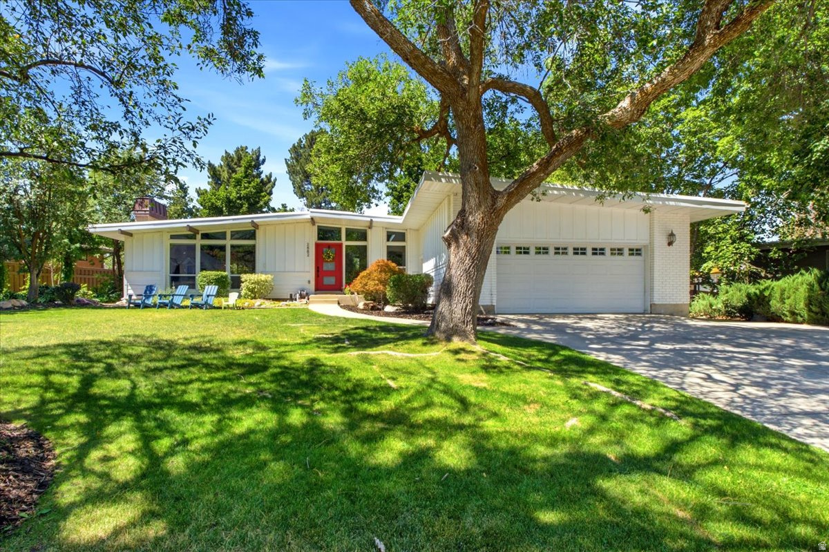 OPEN HOUSE Saturday, July 11th 11am -1pm! Prize property on a rare .36-acre lot backing the 17th fairway of Willow Creek Country Club. This classic mid-century rambler blends timeless architecture with thoughtful modern updates, offering an exceptional combination of location, views, and refined main-level living. The inviting main level features walls of windows that fill the home with abundant natural light, a gourmet kitchen, beamed ceilings, a beautiful new fireplace, fresh paint, and a spacious primary suite with a luxurious bath and walk-in closet. A second main-level bedroom with its own private bath. The lower level offers two additional bedrooms, a generous family room, a large laundry room, and a separate entrance. Step outside to a private backyard oasis framed by mature trees, a basketball court, RV parking and direct gated access to Willow Creek Country Club. Stunning golf course views provide a picturesque backdrop for entertaining, relaxing, or simply enjoying the beauty of the surroundings. Just a short walk to the clubhouse and only minutes from Big and Little Cottonwood Canyons, world-class ski resorts, hiking trails, dining, and recreation, this exceptional property offers the perfect balance of privacy, convenience, and an unmatched lifestyle. A perfect opportunity to enjoy country club living in one of the area's most sought-after locations.
