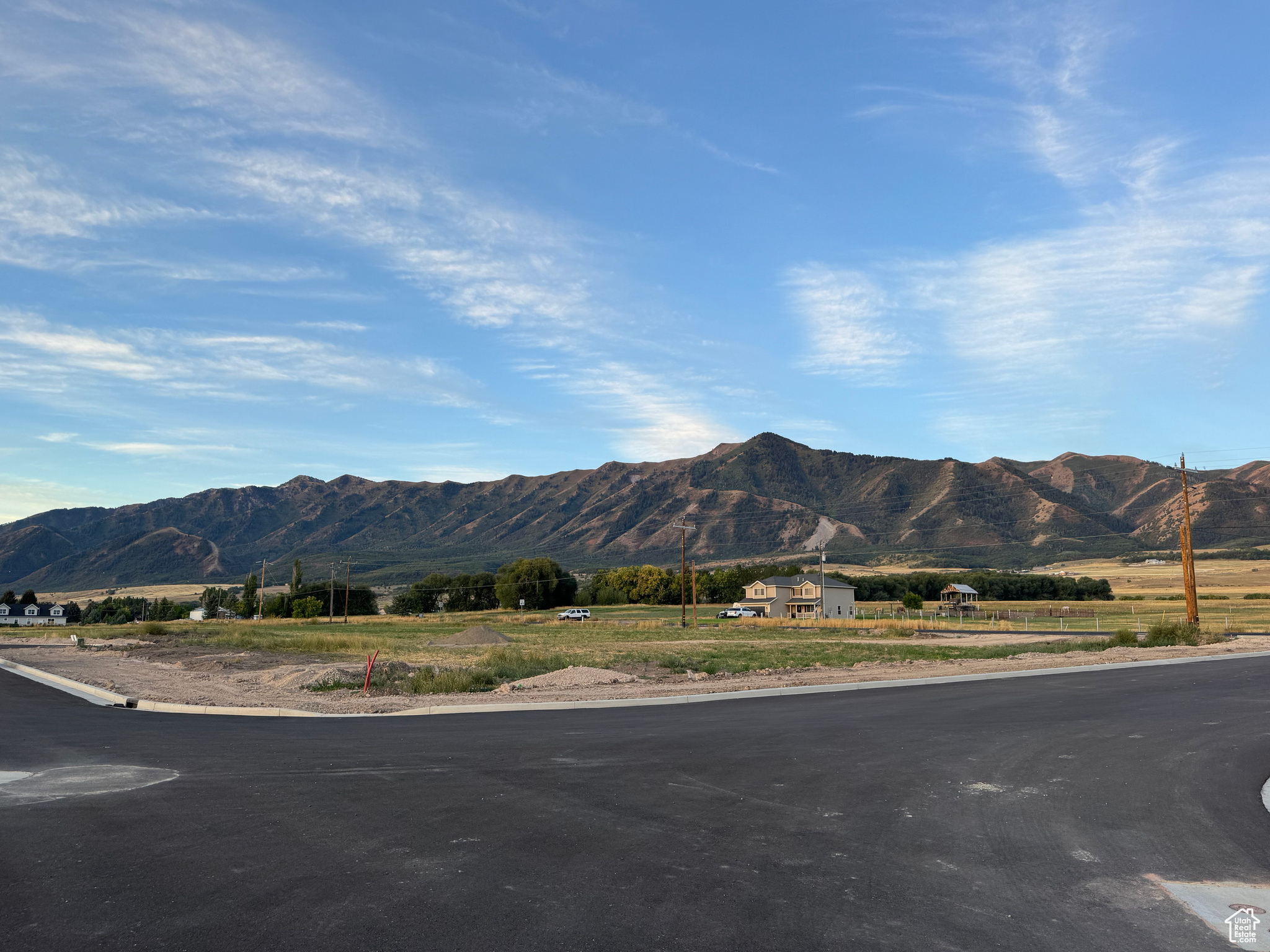 Bring your own Builder! Multiple lots available - Build your dream home in the peaceful and scenic community of Mendon. Blueberry Springs offers spacious 5/8+acre lots with breathtaking views of the mountains and valley. Enjoy paved public roads and full utility access, including Mendon City water, data, power, and secondary water stubbed to each lot. Irrigation water is managed and maintained by the Blueberry Springs HOA. Buyers are responsible for choosing and installing a septic system, subject to approval by Cache County. Each lot includes curb, gutter, and sidewalk frontage. This subdivision allows animal rights in accordance with Mendon City ordinances (https://mendoncityutah.gov). Bring your own builder and design your ideal home while adhering to city setbacks and protective covenants that maintain the neighborhood's appeal.