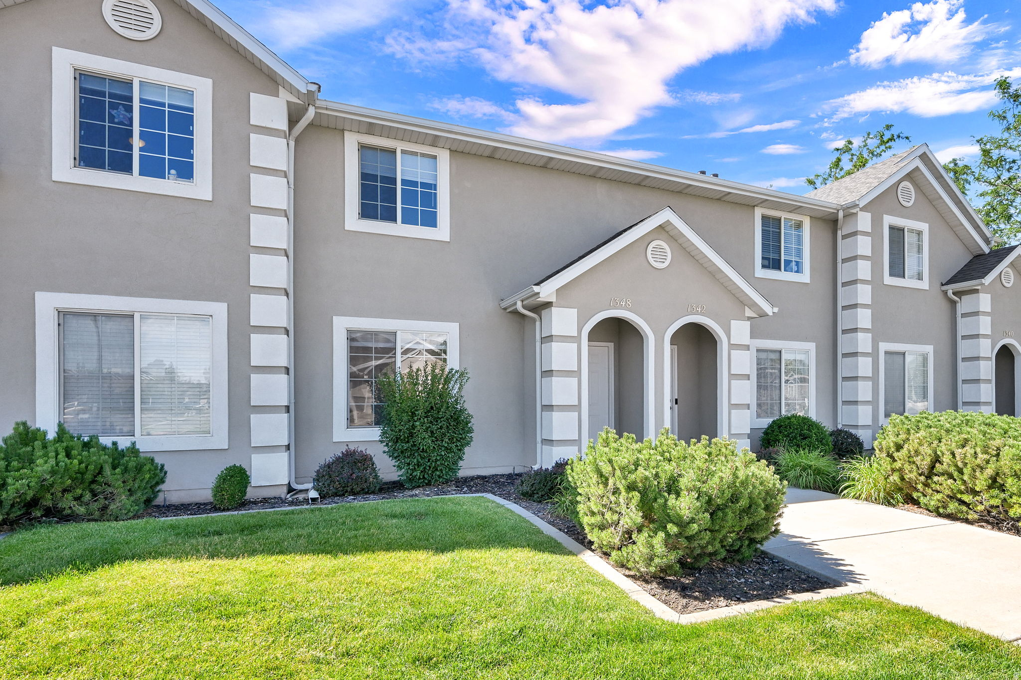 Don't miss this beautifully updated townhome offering modern finishes throughout in one of South Ogden's most convenient locations. Step inside and notice the fresh, thoughtful updates from top to bottom. New water resistant laminate flooring on the main level, new patterned carpet upstairs, and fresh paint throughout that gives the entire home a crisp, move-in-ready feel. Every detail has been addressed: new lighting fixtures, updated outlets and switches, new plumbing fixtures, new blinds, and new knobs and hinges throughout. The kitchen has been updated with brand-new stainless-steel appliances, including the refrigerator, and stunning quartz countertops that extend into both bathrooms. Parking is a non-issue here. The unit includes a 1-car garage plus a dedicated parking spot, with plenty of additional guest parking both in front of and behind the unit. Call today for a private showing!