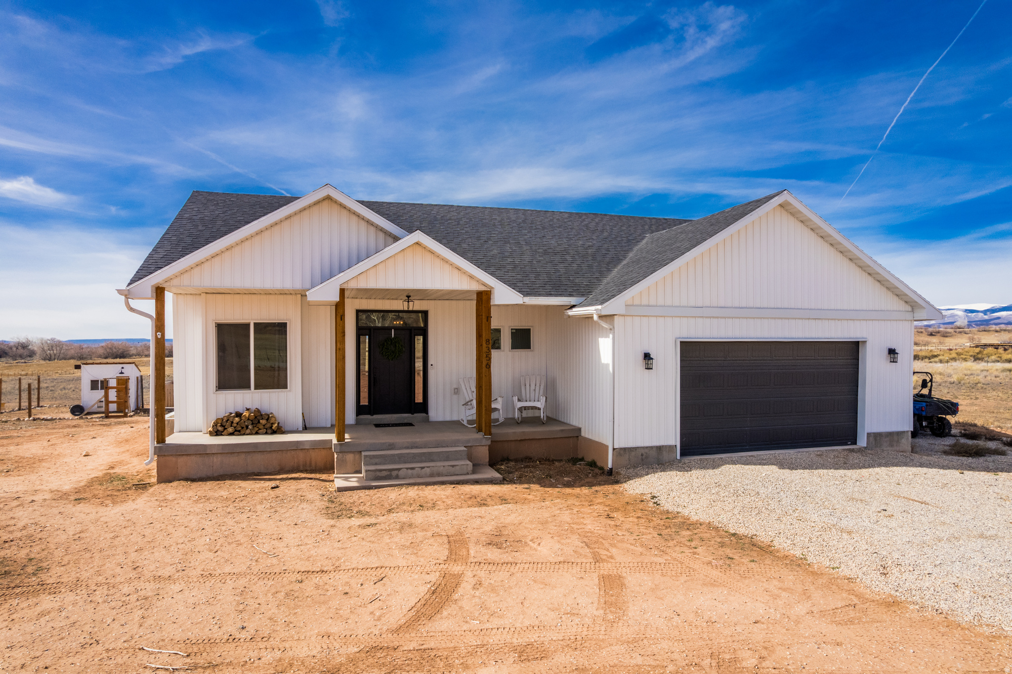Enjoy the peace and quiet of country living while still being close enough to town to appreciate that small-town feel. Take in the wide-open skies, stunning starry nights, and frequent visits from local wildlife including deer, elk, geese, and more - all right outside your door. This custom-built home is filled with natural light and showcases beautiful, one-of-a-kind finishes you simply won't find elsewhere. Thoughtfully designed with character and charm, it offers a warm and welcoming space to call home. With acreage, included water shares, and a clean slate to make it your own, the possibilities here are endless. Create your personal paradise, start a hobby farm, or explore future property division potential. Opportunities like this don't come around often - space, freedom, and potential all in one! Square footage per building plans. Buyer to verify all information including square footage.