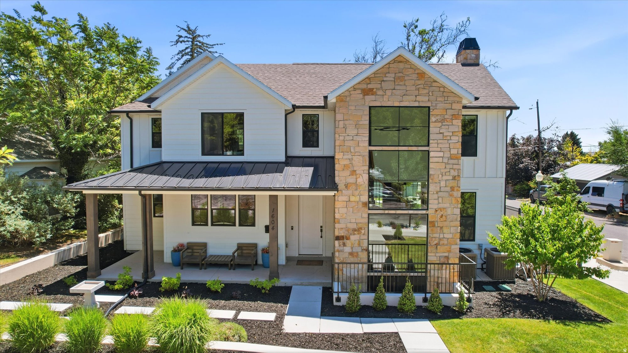 Built in 2020 and ideally situated near Salt Lake City's coveted 15th & 15th neighborhood, this custom home offers over 3,300 square feet of thoughtfully designed living space on a beautifully landscaped corner lot. The open-concept floor plan features soaring ceilings, abundant natural light, custom finishes, and a spacious kitchen that flows seamlessly into the living and dining areas. The upper-level primary suite includes a private sauna, while the fully finished basement with kitchen provides flexible living and entertaining space. A detached garage with a 720 square foot finished basement flex space is ideal for a home gym, office, studio, or creative workspace. Additional features include dual-zone HVAC, whole-house water purification and softening systems, a tankless water heater, covered outdoor living areas, and generous storage throughout. A rare opportunity to enjoy newer construction in one of Salt Lake City's most desirable established neighborhoods.