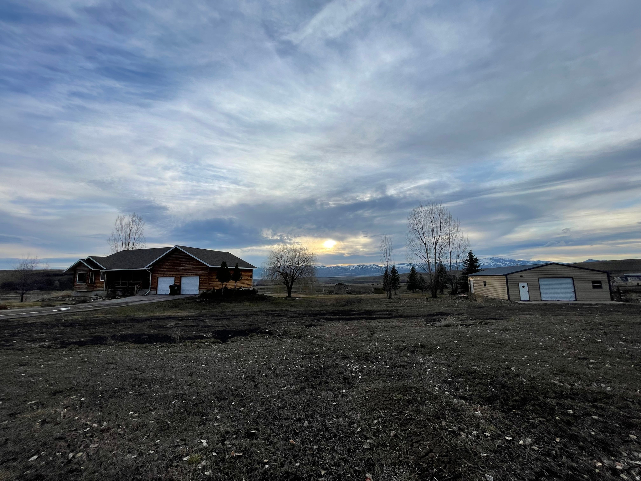 2.5 acres in the heart of southeast Idaho - ideal for horse lovers and those seeking the rural lifestyle! This well-appointed rambler features an attached garage and sits on a beautifully landscaped lot with wonderful panoramic views. A spacious shop building provides ample room for equipment, hay storage, or your favorite hobby. The property is perfectly set up for horses with plenty of room to roam. Enjoy the best of country living without sacrificing convenience - located on a paved road with easy access to both Logan, Utah and Pocatello, Idaho, putting shopping, dining, medical services, and amenities within comfortable reach. Whether you're looking for a horse property, a hobby farm, or simply a peaceful rural retreat with modern convenience, this one checks all the boxes. Come see it today!