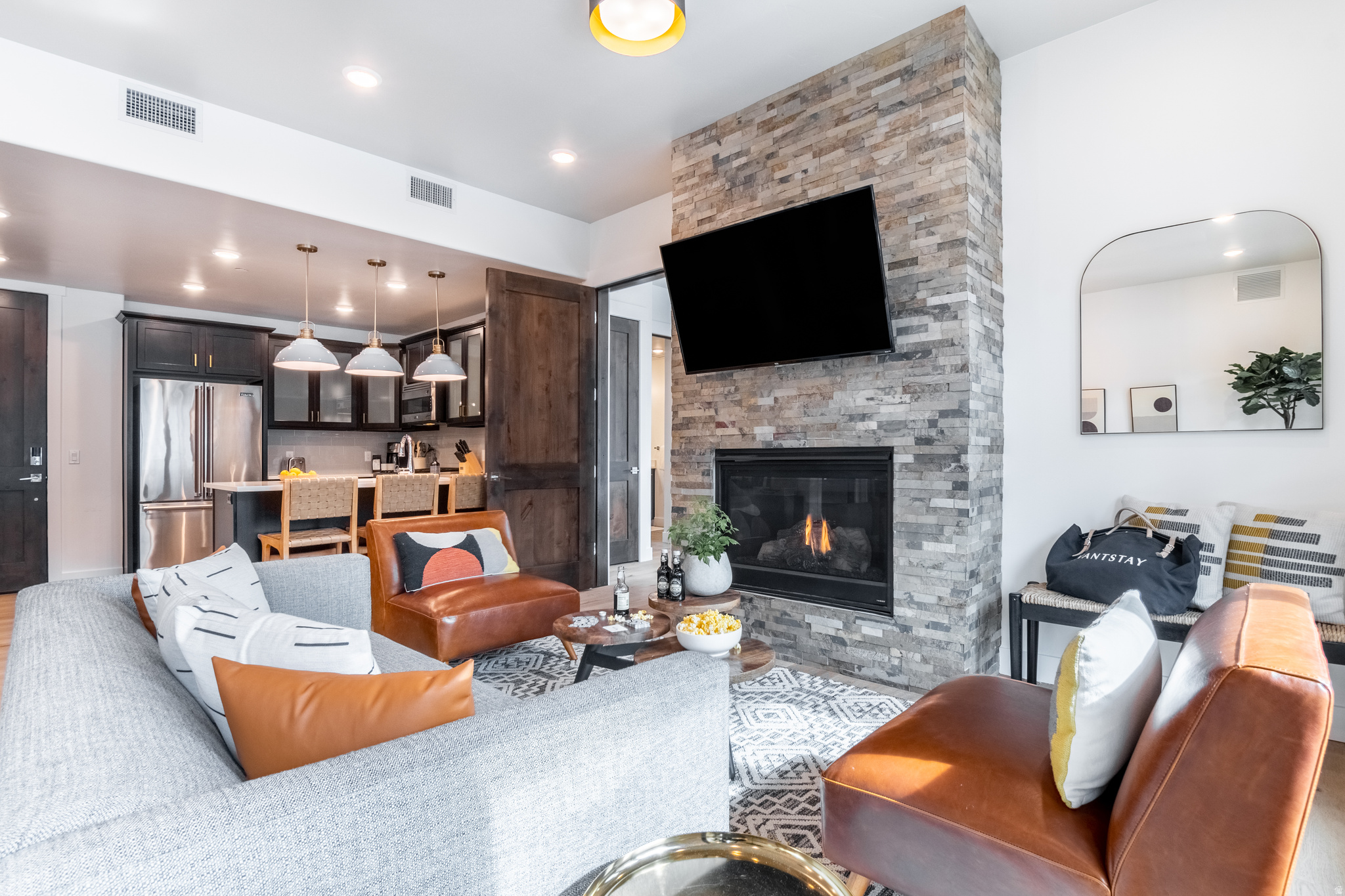 Positioned along the 13th fairway of the Canyons Golf Course and just steps from the Cabriolet lift, this fully furnished 2-bedroom, 3-bathroom Blackstone residence offers one of the most coveted addresses in Canyons Village. Nightly rentals are permitted, making this an exceptional opportunity for personal enjoyment and investment income alike. Thoughtfully designed with expansive windows that frame resort and golf course views, the residence blends elevated mountain style with effortless comfort. The open living area is anchored by a gourmet kitchen featuring quartz countertops and premium Viking appliances, complemented by updated flooring, a gas fireplace, and designer furnishings throughout. Step outside to the covered private deck - an ideal setting for aprs-ski evenings, summer dinners, or quiet mornings overlooking the fairway. Owners enjoy a dedicated heated ski locker with boot warmers, a private storage locker, and covered underground parking - everything needed to make the most of Park City's legendary mountain lifestyle. Beyond your front door, Blackstone's resort-style amenities set the standard for community living: a year-round heated pool and spa, fully equipped fitness center, owner's clubhouse, and Dial-a-Ride shuttle service throughout the village. The beautifully designed outdoor common areas feature multiple fireside seating areas and fire pits - perfect for gathering with family and friends after a day on the mountain. World-class skiing, golf, hiking, dining, and entertainment steps from your door, this residence delivers true resort living on every level. Square footage figures are provided as a courtesy estimate only and were obtained from County Records. Buyer is advised to obtain an independent measurement.