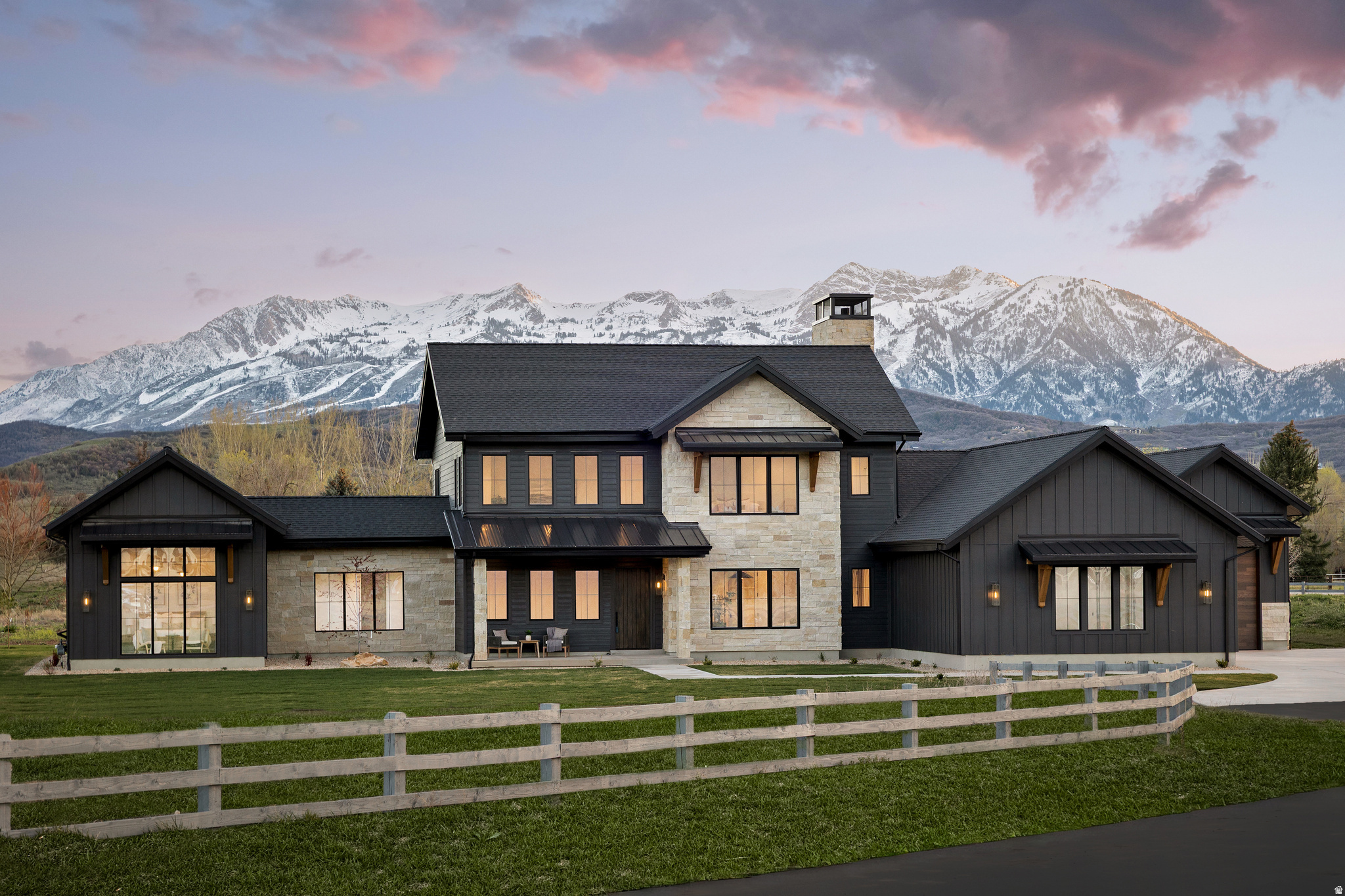 This brand new turnkey luxury Ogden Valley home is ready to make yours! Come discover the epitome of luxury living in the highly sought-after SAGE Community with unobstructed views of Snowbasin Ski Resort and only minutes to Pineview Reservoir. Every detail of this home has been carefully designed with no expense spared, showcasing high-end finishes and a flawless blend of mountain-rustic character with modern elegance. On the main level, you'll enjoy the beamed ceiling, chef's kitchen with its oversized butler's pantry with second refridgerator & dishwasher, dining area, great room with its stunning fireplace encased in stone, a private home office with glass french doors, and a dream primary suite with wood tongue and groove ceiling complete with spa-like features and luxury finishes. Upstairs, you'll find a versatile bonus area/loft along with three bedrooms, each offering its own en-suite bathroom and walk-in closet. For added convenience, laundry areas are located on both levels. Take in the breathtaking mountain views from both the front and back of the home, highlighting the iconic Snowbasin Ski Resort. Perfectly situated, this home is just minutes from historic downtown Huntsville, lake fun in the summer, world-class skiing with 3 local ski resorts, and endless outdoor trails for hiking and mountain biking. Come claim your own slice of mountain paradise! ote: Matterport Tour is Tour 2, great for out-of-area Buyers who want a 3D tour & & 4-Way Video is Tour 3 for the future homeowners to know exactly where everything is located behind the walls. This is just another way, that this Builder went above and beyond for the future homeowner.