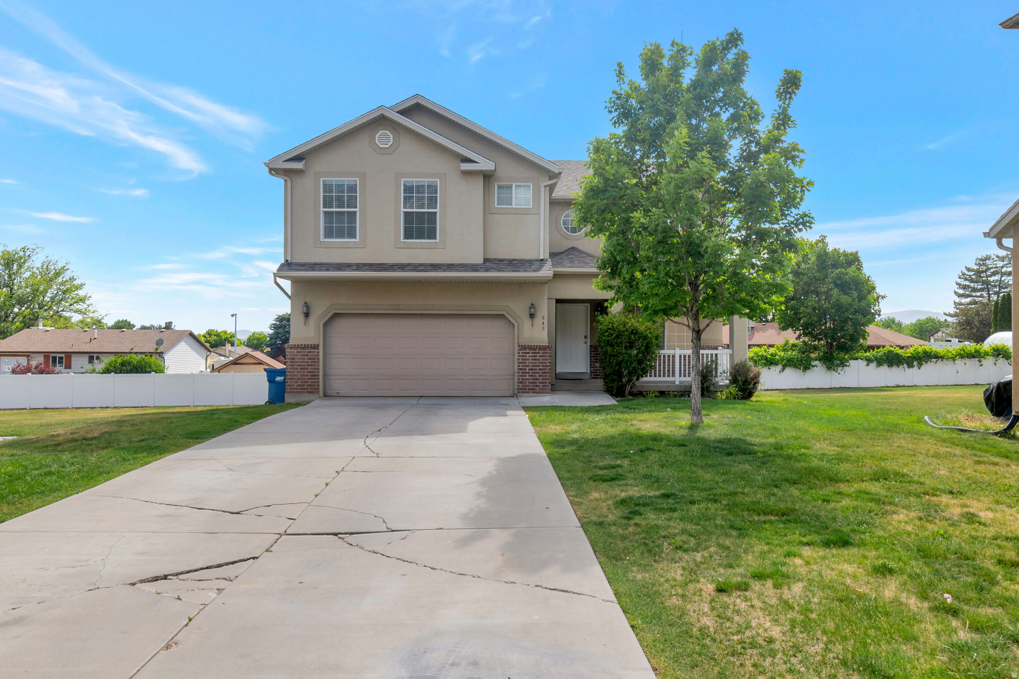Rare 7-bedroom home in Apple Grove - the largest floor plan in the community and completely move-in ready. Fully renovated from top to bottom with new white kitchen cabinets, quartz countertops in all bathrooms, new carpet, LVP flooring, tile in every bathroom, modern light fixtures, and new toilets and faucets throughout. Brand-new roof installed, offering peace of mind for years to come.  The fully finished daylight basement adds 2 bedrooms and a full bathroom, ideal for guests, teenagers, or a home office setup. The main level features an updated kitchen with granite countertops, a gas fireplace with insert, and a spacious open-concept great room. Upstairs offers 5 bedrooms, including a large primary suite with a jetted tub and walk-in closet.  Enjoy low-maintenance living with HOA-covered exterior landscaping. Community amenities include a playground, pavilion, BBQ areas, and walking and biking trails. Beautiful mountain and lake views complete the setting. The home also features a 2-car attached garage with a long private driveway.  Finding another 7-bedroom home under $700K in Pleasant Grove is rare - don't miss this opportunity.  Square footage is based on county records; buyers are advised to verify all information independently.
