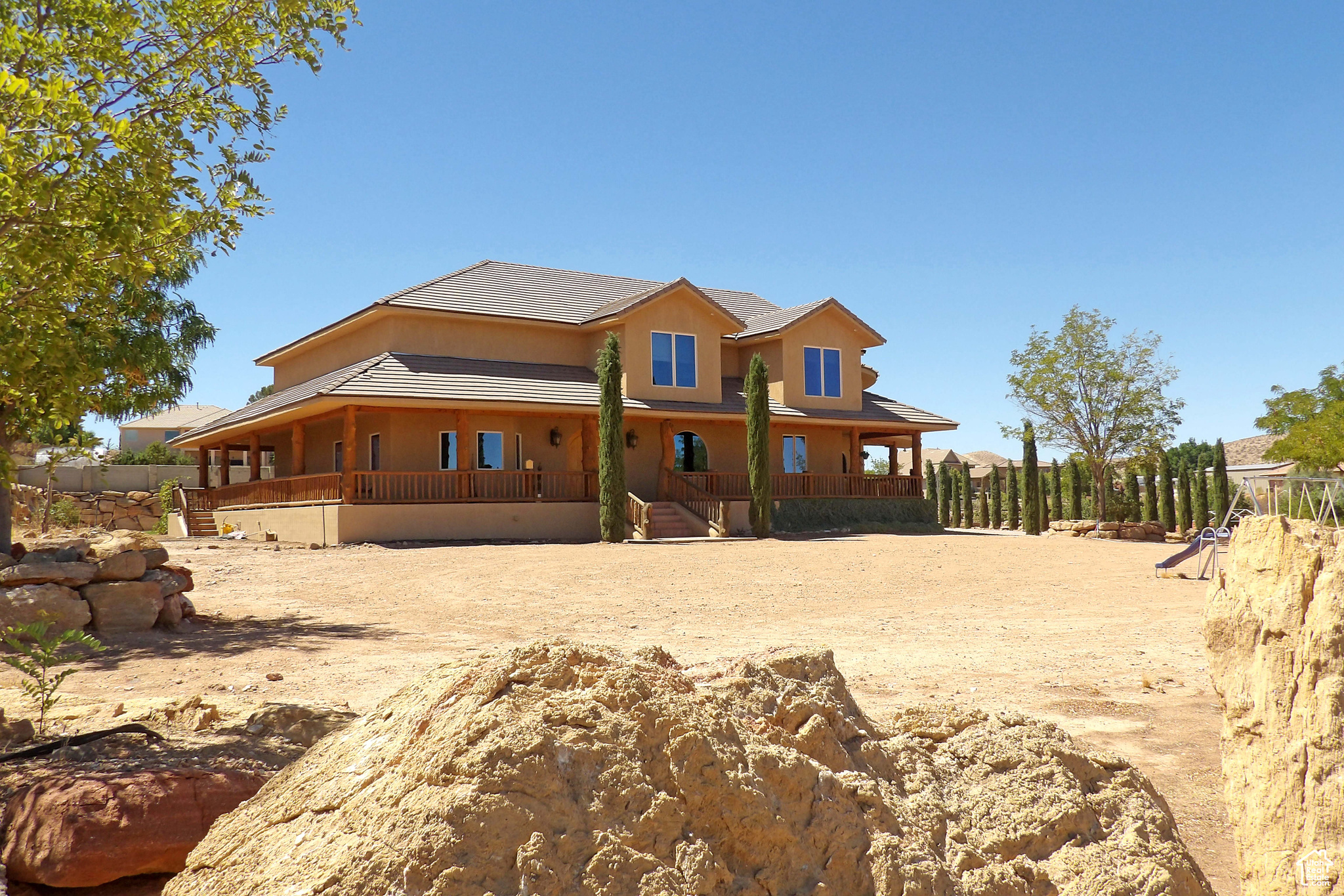 : Incredible Ranch Estate with horse privileges.  Entering the home, you're greeted by vast spaces for entertaining, corporate retreats & more. Massive backyard is privately fenced in ''compound'' style & will make a great location for your next big event or just a family get-together. 5-Car ultra-high garage houses an array of toys, geothermal heat is super-efficient & location is superb.  Sold AS/IS.  All garages are plumbed for an air compressor. The shop Garage is wired for 220 outlets. Heating and Air is 3 Geo-thermal Heat and air pumps, the air is 68 degrees, constant air. The basement is fully enclosed in Concrete, 2'' foam insulation ICF forms inside and out on the main floor, plumbed for a kitchen in the basement, and has a special engineered ceiling over the basement that eliminates any posts or walls in the basement.