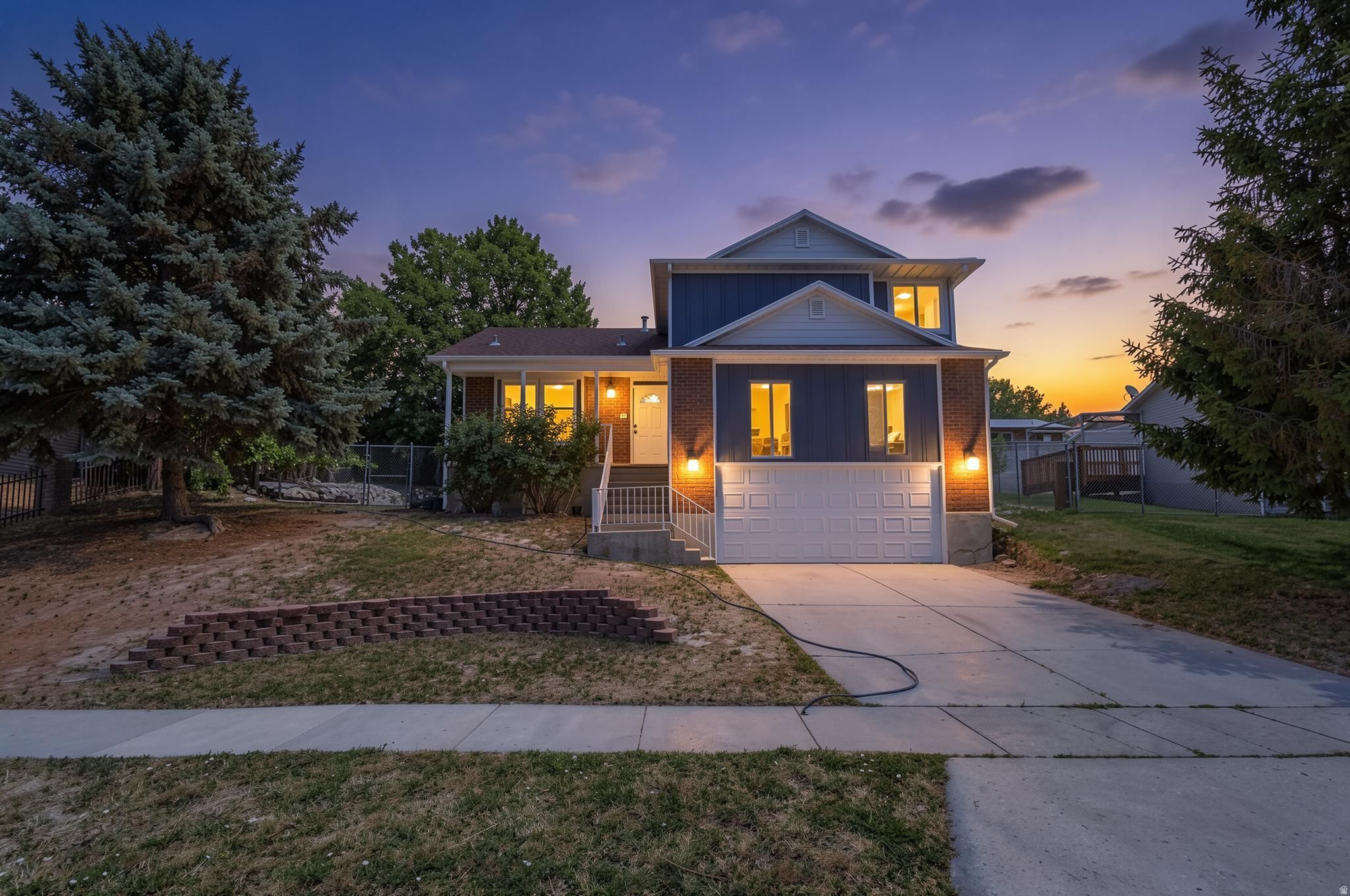 Welcome home to this beautifully updated 4-bedroom, 3-bathroom property in the heart of Murray!   Step inside to a bright and inviting floor plan featuring vaulted ceilings in the front living room, and recent updates made which include a roof that is only 4 years old, all-new James Hardie fiber cement siding, whole-home wrap, new gutters, soffits, and gutter covers completed approximately 3.5 years ago, and a new garage door installed less than a year ago. The interior has also been refreshed with new flooring in the basement, on the stairs, and in the living room, along with a newly installed oversized basement window well that brings in additional natural light.  There is a built-in garage, and a cozy electric fireplace.  The primary suite offers beautiful mountain views with a glimpse of the lake. Additional features include a disposal and rainwater collection barrels already in place for future use.  One of the standout features of this home is its unbeatable location near Willow Pond Park. Enjoy easy access to fishing, three playgrounds, soccer fields, baseball fields, a splash pad, walking paths, and countless opportunities for outdoor recreation. You'll also love the convenient access to the Jordan River Trail, perfect for biking, jogging, or leisurely walks while enjoying Utah's natural beauty. Don't miss your opportunity to make it yours!