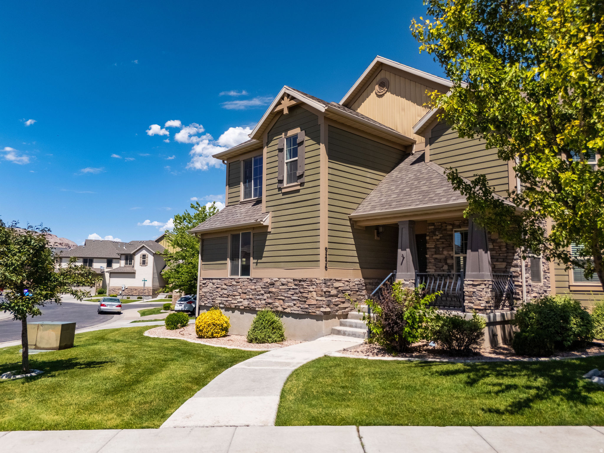 Enjoy extra space, privacy, and mountain views in this spacious end-unit townhome with over 2,500 square feet in the desirable Ranches of Eagle Mountain, just steps from The Ranches Golf Course. This well-maintained home features fresh paint, new carpet, and a functional floor plan with room for everyone.  The main level offers comfortable living and entertaining space, while upstairs you'll find three bedrooms, including an oversized primary suite with a walk-in closet. The finished basement adds a newly completed fourth bedroom and full bathroom, plus an additional family room and a large cold storage area.  Outside, you'll appreciate the attached two-car garage and the extra open space surrounding this end unit, providing more yard and added privacy than many neighboring homes. Located in a peaceful community with convenient access to parks, trails, schools, shopping, and outdoor recreation, this home offers the space, updates, and location you've been looking for.