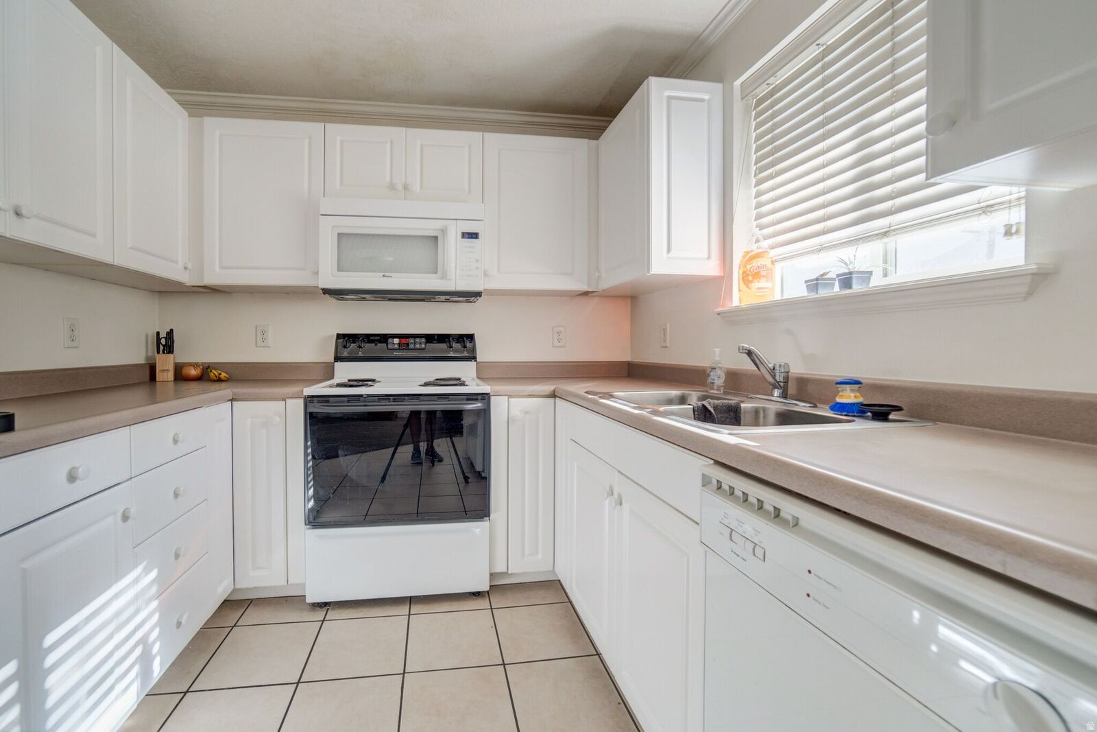 Excellent 4 bedroom condo close to BYU & (1/2 block to) UVX bus stop. City zoned for 4 singles or a family. Middle (3rd) floor with great mountain views. Plenty of parking for everyone in the complex. Fully rented through August 2027 making it a great turnkey investment! New flooring (LVP) installed  throughout in 2025!  Walking distance to bus stop, Smith's grocery, lots of shopping and restaurants downtown!  Must give 24 hours notice to show. No exceptions.  Please do not ask.  No Sunday showings.  Please keep showings between the hours of 9 AM - 7 PM.  Please submit all offers to hilaryadavis@gmail.com.  Square footage figures are provided as a courtesy estimate only and were obtained from county records . Buyer is advised to obtain an independent measurement.