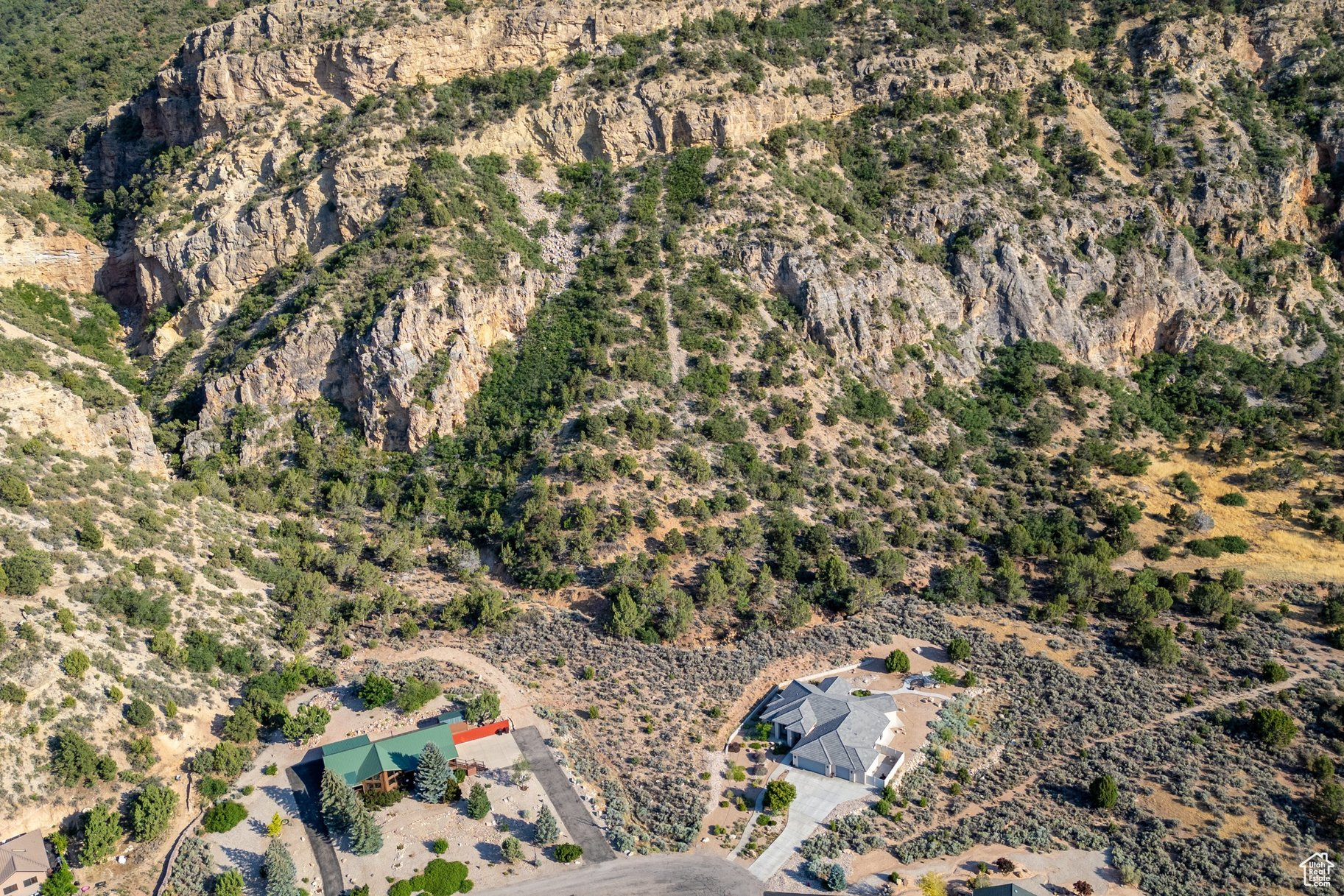 This remarkable 3.34-acre parcel backs directly to the mouth of Wayne Canyon, offering a rare sense of seclusion and connection to nature. With no rear neighbors and direct access to the canyon, the property feels like a private extension of the landscape-perfect for those seeking peace, privacy, and panoramic views. Whether purchased as part of the neighboring home or on its own, this land presents a unique opportunity to create a personal retreat surrounded by natural beauty.