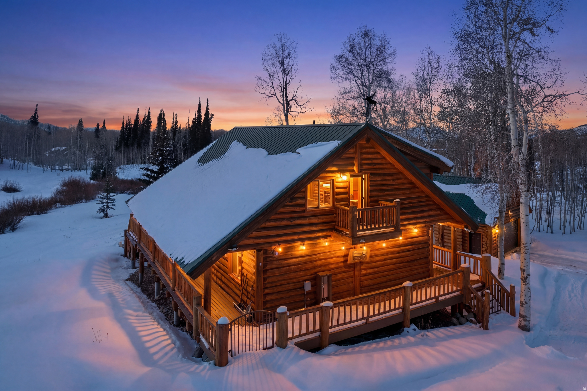 Experience the pinnacle of private mountain luxury with direct Uinta National Forest access, serene pond frontage, and unmatched year-round recreation from your own custom log estate in Timber Lakes Estates. This exceptional 2,870 sq ft custom log cabin is set on 1.54 acres across two combined lots, offering rare privacy and a premier setting adjoining a 7-acre common area with a private pond, perfect for summer and winter recreation. Thoughtfully designed for both comfort and adventure, the property includes an attached 260 sq ft ATV garage within the primary residence, as well as a detached custom suspended slab garage featuring two vehicle bays above and an additional ATV/UTV garage below, for a total of four garage spaces and abundant storage for all-season recreational equipment.  Inside, the home showcases timeless log craftsmanship, warm natural finishes, and an inviting open-concept design, creating a refined yet comfortable mountain living experience. Furnishings are negotiable, offering a potential turn-key opportunity. Located within Timber Lakes Estates, a private guard-gated community just 7 miles east of Heber City, residents enjoy towering aspens, lake views, and direct access to thousands of acres of Uinta National Forest, with unparalleled snowmobiling and trail access right from the property. Conveniently situated 12 minutes to Heber, 30 minutes to Park City, and approximately one hour to Salt Lake City or Provo, this home provides effortless access to world-class skiing, golf, fishing, boating, hunting, ATV riding, and year-round outdoor recreation in the highly sought-after Heber Valley and Park City areas.  A rare opportunity to own a luxury mountain retreat with acreage, privacy, and premier recreation access in one of Utah's most desirable gated communities.