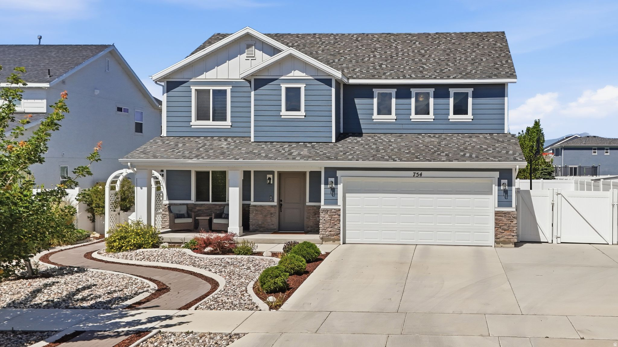 This stunning home in the gorgeous Stonecreek Estates community of American Fork is one you won't want to miss! With fantastic curb appeal right from the start, beautiful xeriscaping, bold stone-textured accents, permanent exterior and holiday lighting, and great mountain views, this gem is move-in ready!  CHECK OUT THE INCLUSIONS LIST!!!  The owners are including: Hot tub (with towel rack and bench), washer, dryer, refrigerator, family room TV and mount, basketball hoop (side of the house), permanent holiday lighting, kitchen island chairs, and Ring doorbell system.  Step inside and you'll love the welcoming main floor, where a cozy sitting area flows beautifully into a spacious kitchen with a large island, pantry, stainless steel appliances, and open dining and family room. A convenient main-floor bedroom and full bath round out this level nicely. Upstairs, the primary suite offers a true retreat with a generous walk-in closet and spacious shower, plus two additional bedrooms, another full bath, and the laundry room. The bright, sunny loft is a fantastic bonus that can easily become a 5th bedroom or office!  The .17-acre fully landscaped lot is ready for you to spend your summer nights outdoors, featuring a relaxing hot tub on the patio, multiple seating area options, a basketball hoop, beautiful landscaping and a fully fenced backyard. The extra-wide driveway provides ample parking plus boat/RV space with electrical hookup.  All offers must be submitted with a pre-approval letter or proof of funds. Square footage figures are provided as a courtesy estimate only. Buyer is advised to obtain an independent measurement.