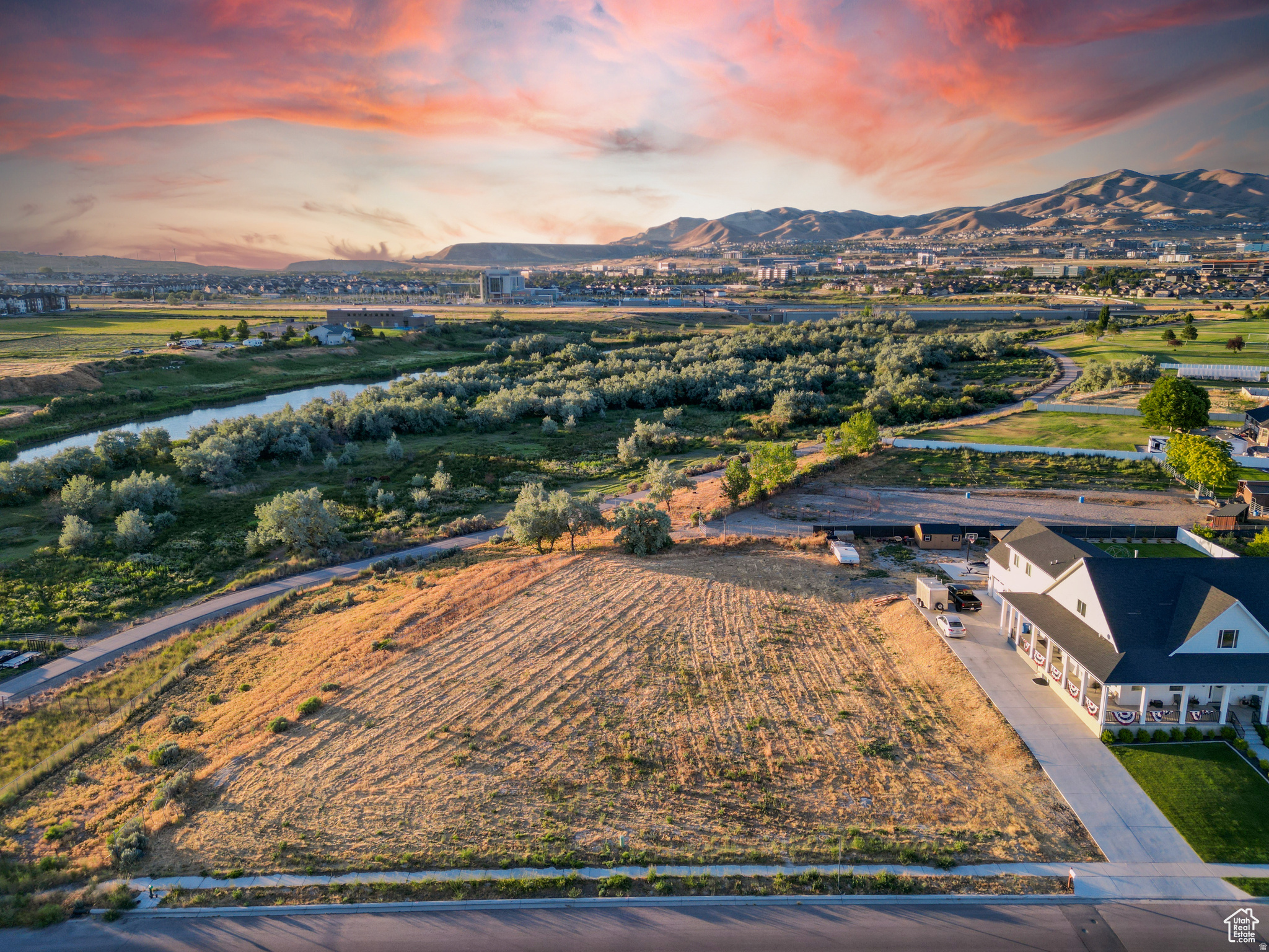 **RARE ANIMAL RIGHTS! Contact the Listing Agent for more details** Discover a truly exceptional opportunity to own a nearly 0.7-acre building lot in Lehi, UT. Nestled adjacent to the serene and picturesque Jordan River, this expansive lot offers a unique blend of natural beauty and modern convenience. ------- Located in a coveted area surrounded by high-end, multimillion-dollar homes, this property embodies luxury and exclusivity. Its proximity to the bustling Silicon Slopes makes it an ideal spot for tech professionals and entrepreneurs seeking a tranquil yet accessible retreat. Plus, with downtown Salt Lake City just a short 30-minute drive away, you'll enjoy the perfect balance of suburban peace and urban access. ------- There is no HOA! All utilities are conveniently stubbed to the lot, streamlining the building process for your dream home. The land itself is flat, useable, and boasts incredible views of the Wasatch Range, Jordan River, and mountains to the west. Whether you envision a modern architectural masterpiece or a charming, traditional home, this lot provides the perfect canvas for your vision. ------- This rare find in Lehi not only promises an enviable lifestyle but also the chance to create a legacy home that will be cherished for generations. ------- Seize this rare opportunity to build your dream home in one of Utah's most desirable areas. Please reach out and contact me with any questions. All information within this listing should be considered accurate, but all prospective buyers are encouraged to independently verify any and all information to their satisfaction.