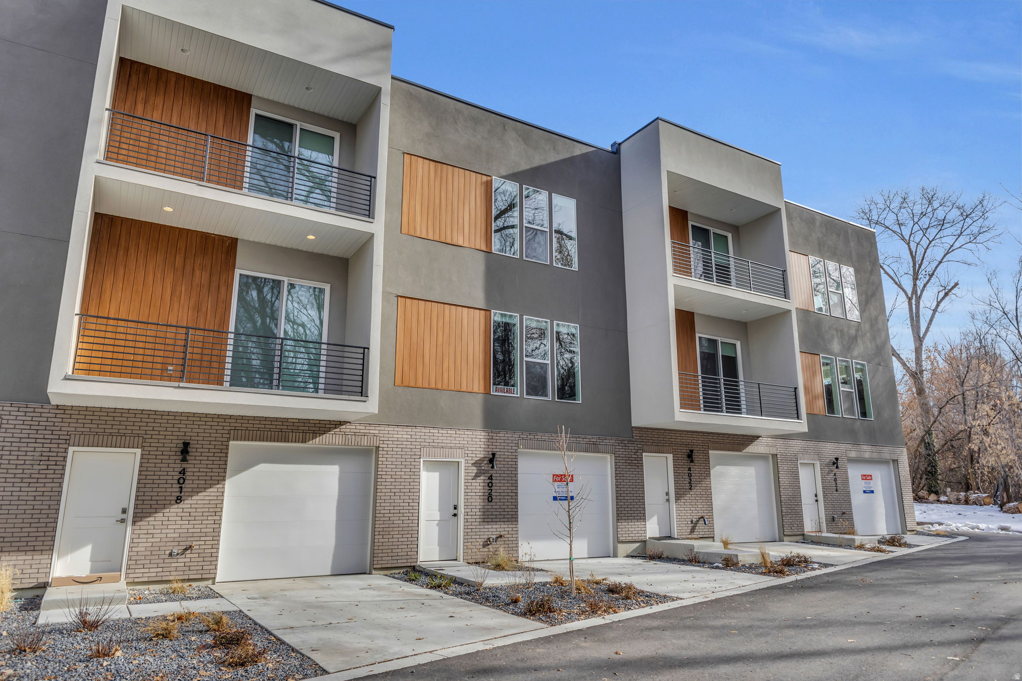 MODEL HOME HOURS TUES-FRI 12pm-4pm. Get $10,000 in concessions plus blinds and a fridge when you use our preferred lender. Explore our spacious THREE-story townhomes in a secluded spot in South Ogden, right by Burch Creek! These townhome's feature a huge kitchen with custom soft-close cabinets and sleek leather granite countertops. The primary suite features a large walk-in closet, tile surround shower, dual sink vanities in the bathroom and a private balcony with a gorgeous creek view. This home feels so spacious with 10ft ceilings on the first floor and 9ft on the second story. Plus, there's a huge two-car tandem garage with plenty of storage. And it's super convenient, just 2 miles from Weber State University and close to Riverdale's shopping and dining hotspots. HOA will approve rental use, making these townhomes a fantastic investment opportunity!