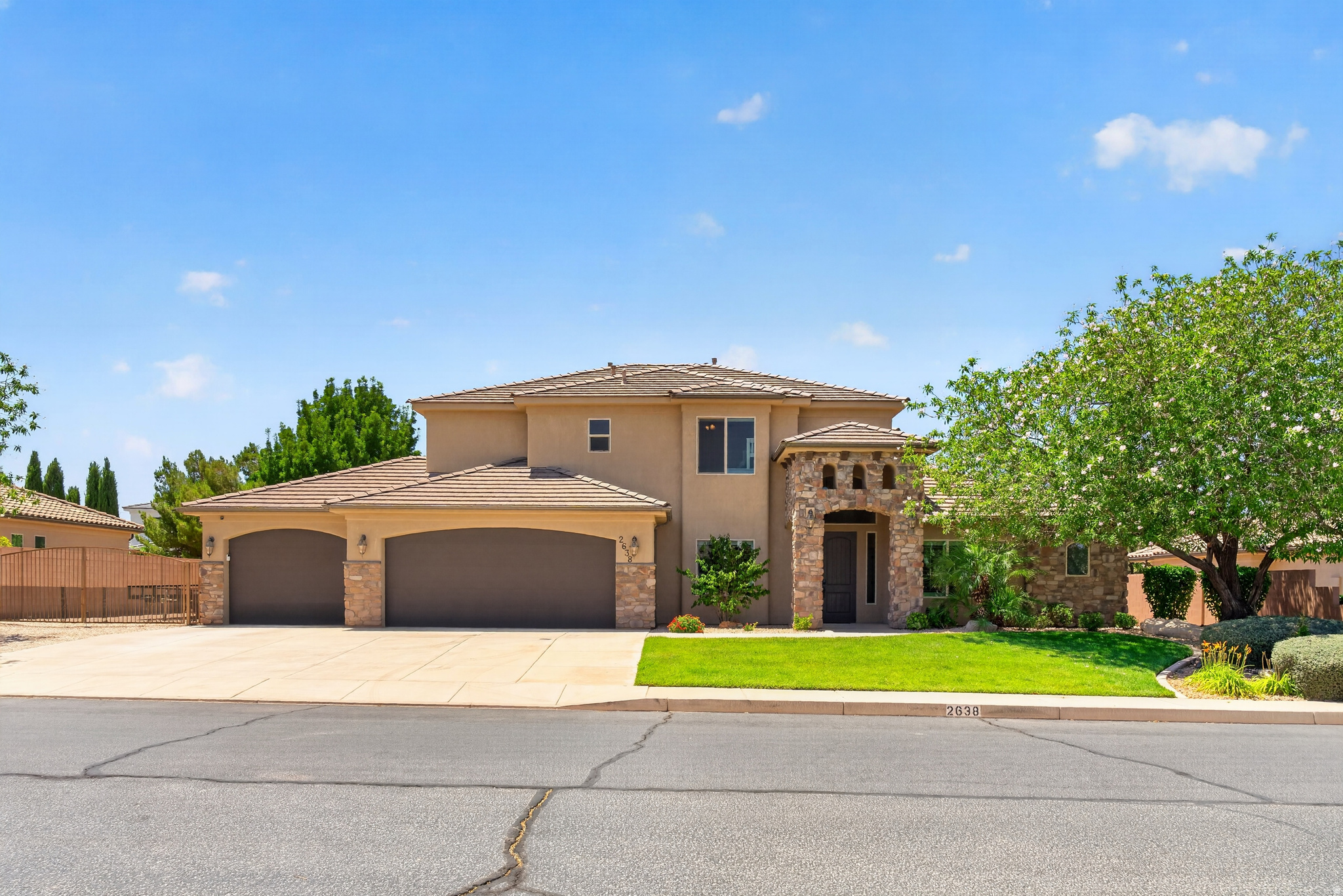 This immaculately maintained two story home in Bridle Gate Estates has been used only a handful of times and truly shows like it. From the moment you step in you are greeted by a zero step entry, large windows that flood the space with natural light, a formal living room, a dedicated office that works as a fifth bedroom, a large laundry room, and a three car garage, all on the main level. The kitchen is built for entertaining with double ovens, a gas stove, and granite countertops. The primary suite is a true retreat on the main floor featuring a walk in closet, double vanities, and a soaking tub. Upstairs you will find additional bedrooms with two joined by a jack and jill bath, a bonus flex room currently set up with four bunk beds that is perfect for family visits, and there is also hook ups for a second laundry room. The backyard is its own private escape enclosed by a full masonry wall with a pool and spa featuring a waterfall and electronic retractable cover, mature shade trees, and a covered patio made for year round enjoyment. Interior recently repainted. Furniture available for purchase. Bridle Gate Estates offers an exclusive private equestrian center available to residents only.