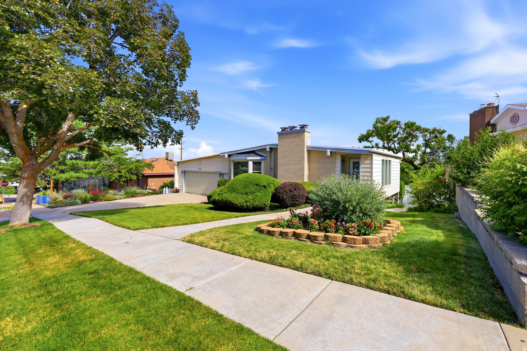 Welcome home to a charming residence in one of the most established areas of Cottonwood Heights. Enjoy stunning mountain and valley views from a bright, inviting great room with floor-to-ceiling windows and a classic, timeless feel throughout. Outside, you'll love the large, beautifully landscaped yard-perfect for gatherings, play, and outdoor living-with plenty of space and mature trees that provide privacy and shade. Inside, this home offers 6 bedrooms and 3 updated bathrooms, along with an updated kitchen featuring granite countertops and a spacious large island-ideal for everyday life and entertaining. Additional highlights include real Bruce wood floors, crown molding, gas and wood fireplaces, new windows, built-ins for smart storage, closet organizers, 2 year old furnace and AC, one year old water heater and even a dedicated area that can be used as a craft room or flex space to match your lifestyle. All the schools in the area have all been recently rebuilt. Come see this beautiful Home as soon as you can! *Seller is building a new home with possession sometime in October and would love to only have to move once* Please call agent with any questions.* Square footage figures are provided as a courtesy estimate only and were obtained from County Records. Buyer is advised to obtain an independent measurement.