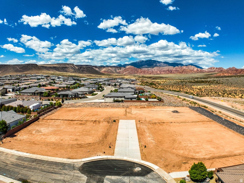 Exceptional opportunity to build in an exclusive new four-lot subdivision, ideally situated just off Washington Parkway and surrounded by established, upscale neighborhoods. These premium homesites offer convenient access to shopping, dining, recreation, and major travel routes, all while showcasing breathtaking views of the iconic red rock landscape. Generous lot sizes provide the perfect canvas for a custom home designed to fit your vision.