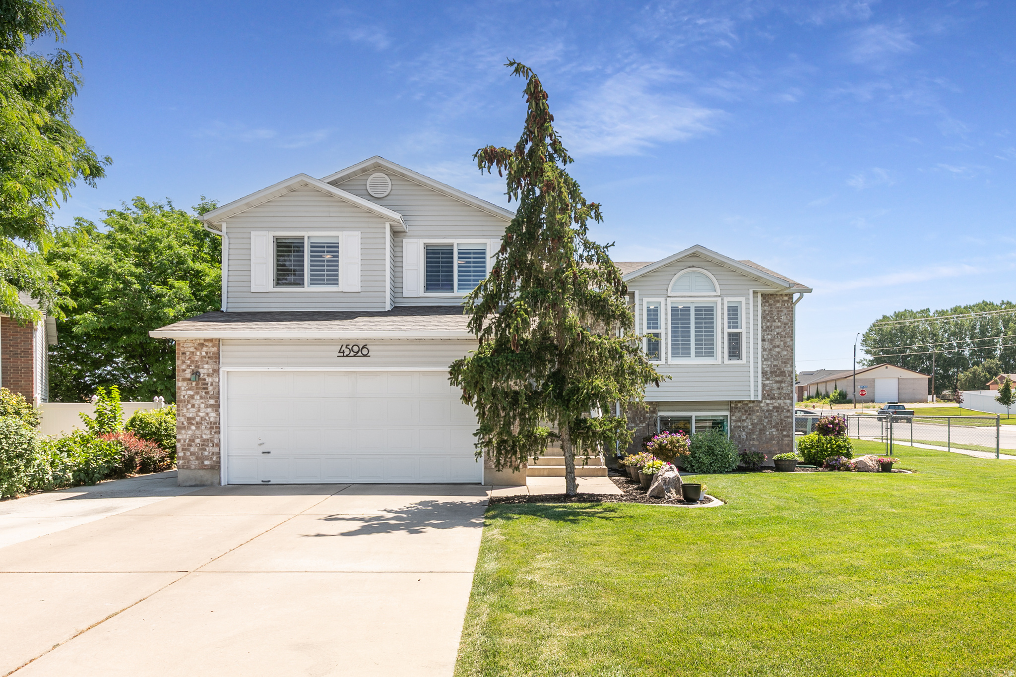 OPEN HOUSE SATURDAY JUNE 27 11-2. Stunning turnkey multi-level home nestled in a quiet cul-de-sac with minimal traffic, yet conveniently located near shopping, schools, parks, and commuter routes. Filled with natural light and modern upgrades throughout. This home offers the perfect blend of style, comfort, and functionality. The beautifully remodeled kitchen features white painted cabinetry, quartz countertops, and updated lighting, while fresh paint and luxury vinyl plank flooring extend throughout the home. The oversized dining area provides ample space for entertaining and family gatherings, and the spacious family room serves as the heart of the home with a cozy gas fireplace. The fully finished lower level adds flexibility with a bedroom,  bath, and office/flex space. Major improvements provide peace of mind, including a new roof (2019), new windows, 4-inch plantation shutters, upgraded bathrooms with new vanities, and a luxurious primary bath featuring quartz countertops and a premium bidet. Outside, enjoy a fully landscaped yard with a professionally installed sprinkler system (2024) designed for efficient watering and easy maintenance. The location is exceptional. Midland Elementary is just a short walk away, and Roy West Park is less than half a mile from the home, connecting to the Denver & Rio Grande Rail Trail for miles of walking and biking. The Roy Aquatic Center and golf course are also just minutes away, offering recreation opportunities for all ages. Move-in ready and loaded with upgrades-this is one you won't want to miss!