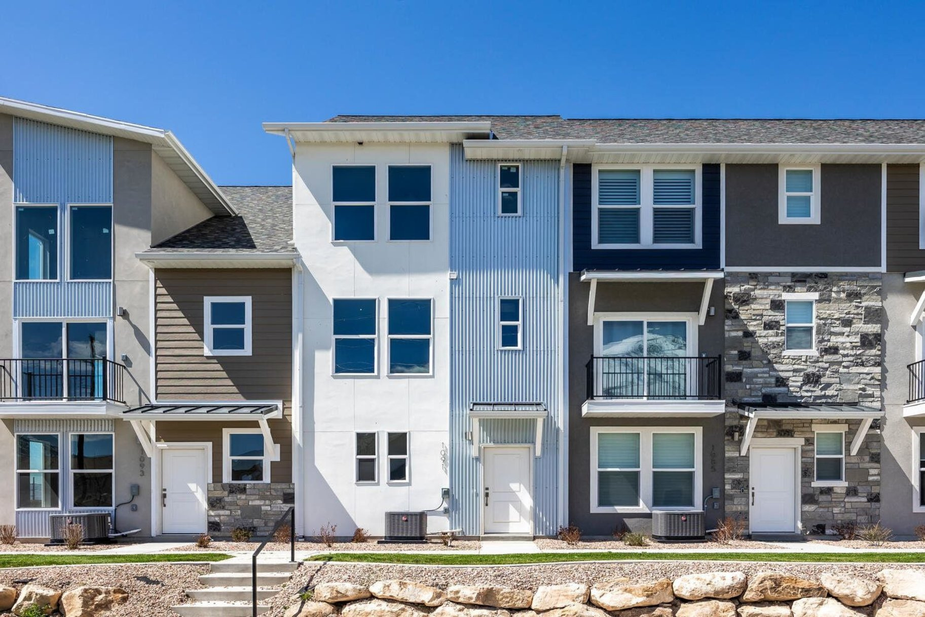 Beautiful three-bedroom townhome at the Ridge at Spanish Fork. This is a three-bedroom Midtown plan that features two ensuite bedrooms, a nice family room, and a large kitchen with a back covered deck. It has a one car attached garage. The Ridge at Spanish Fork is a beautiful townhome community located on the east end of Spanish Fork. The Ridge has a clubhouse with a fitness center, an indoor/outdoor pool, new pickleball courts, and a dog park. The development is conveniently located near shopping (there is a grocery store across the street and Costco is just down the road), restaurants, schools, and only minutes from I-15 and the mouth of Spanish Fork Canyon. The Ridge offers two, three, and four-bedroom floor plans. There is new inventory available and we also work with investors. Come tour the model for more information. Use our preferred lender and receive a $10,000 credit for a rate buydown or closing costs. Photos are of a similar finished unit.