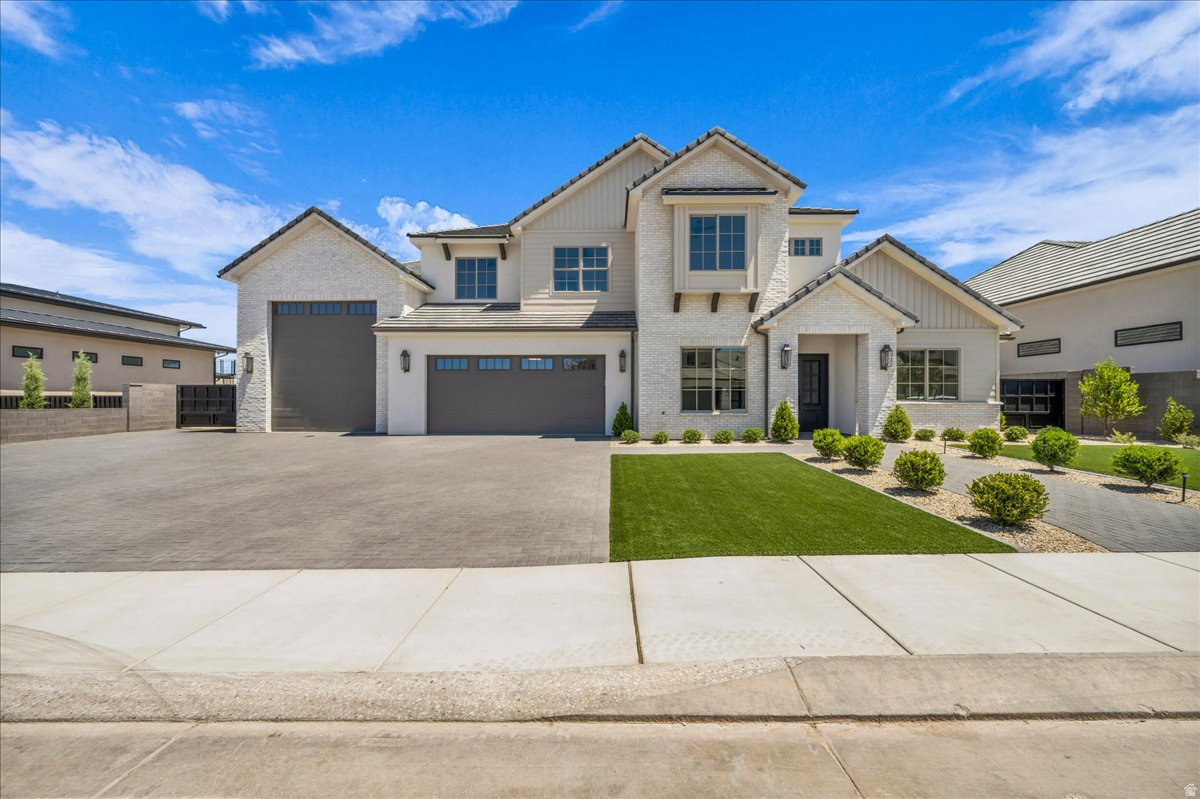This exceptional 6-bedroom, 5.5-bath custom home offers luxury finishes, breathtaking panoramic red rock and mountain views, and an open-concept floor plan designed for modern living. The chef's kitchen features premium appliances, custom cabinetry, quartz countertops, and an oversized island that flows into the spacious great room with soaring ceilings and a beautiful fireplace. The luxurious primary suite includes a spa-inspired bath with a freestanding tub, oversized walk-in shower, and generous walk-in closet. Enjoy resort-style outdoor living with a private pool, covered patio, and upper viewing deck perfectly positioned to capture the incredible views. Complete with an oversized RV garage and designer finishes throughout, this home is an exceptional blend of luxury, comfort, and Southern Utah living. Reach out to schedule a showing today!