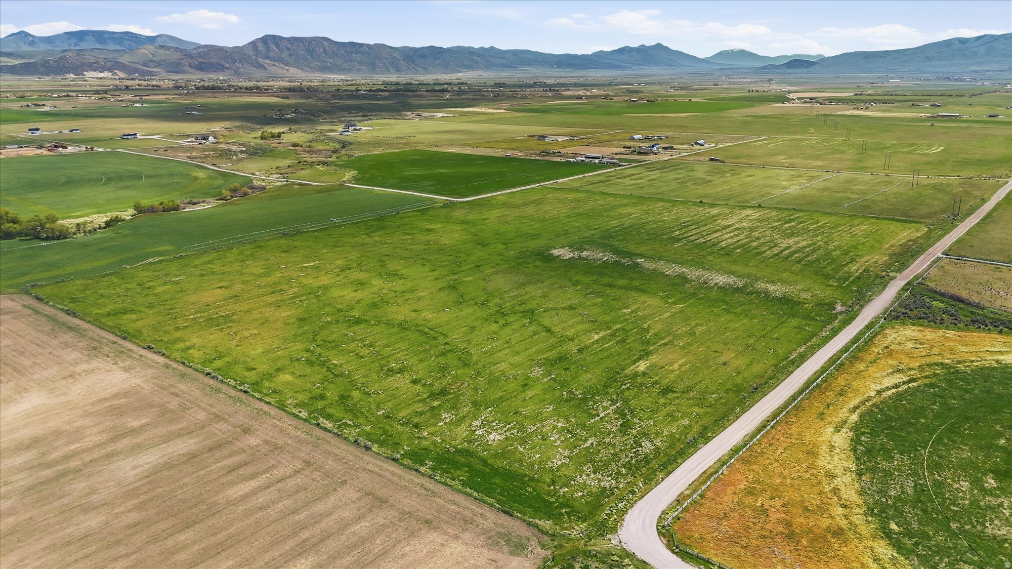 Looking for the perfect rural country setting to build your dream home? This flat 25+ acre parcel is surrounded by beautiful rolling hills and farmland, offering endless possibilities for a homestead, farming operation, or peaceful country living. Power is nearby, and a well has already been drilled, making this property ready for you to begin building. The property is partially fenced and has previously been farmed in alfalfa under a verbal agreement. If desired, buyers also have the opportunity to purchase the adjacent southern parcel, creating approximately 50 total acres. Rare opportunity to own a beautiful piece of country property with room to make your dreams a reality! Newly Surveyed .Buyer to verify all information.