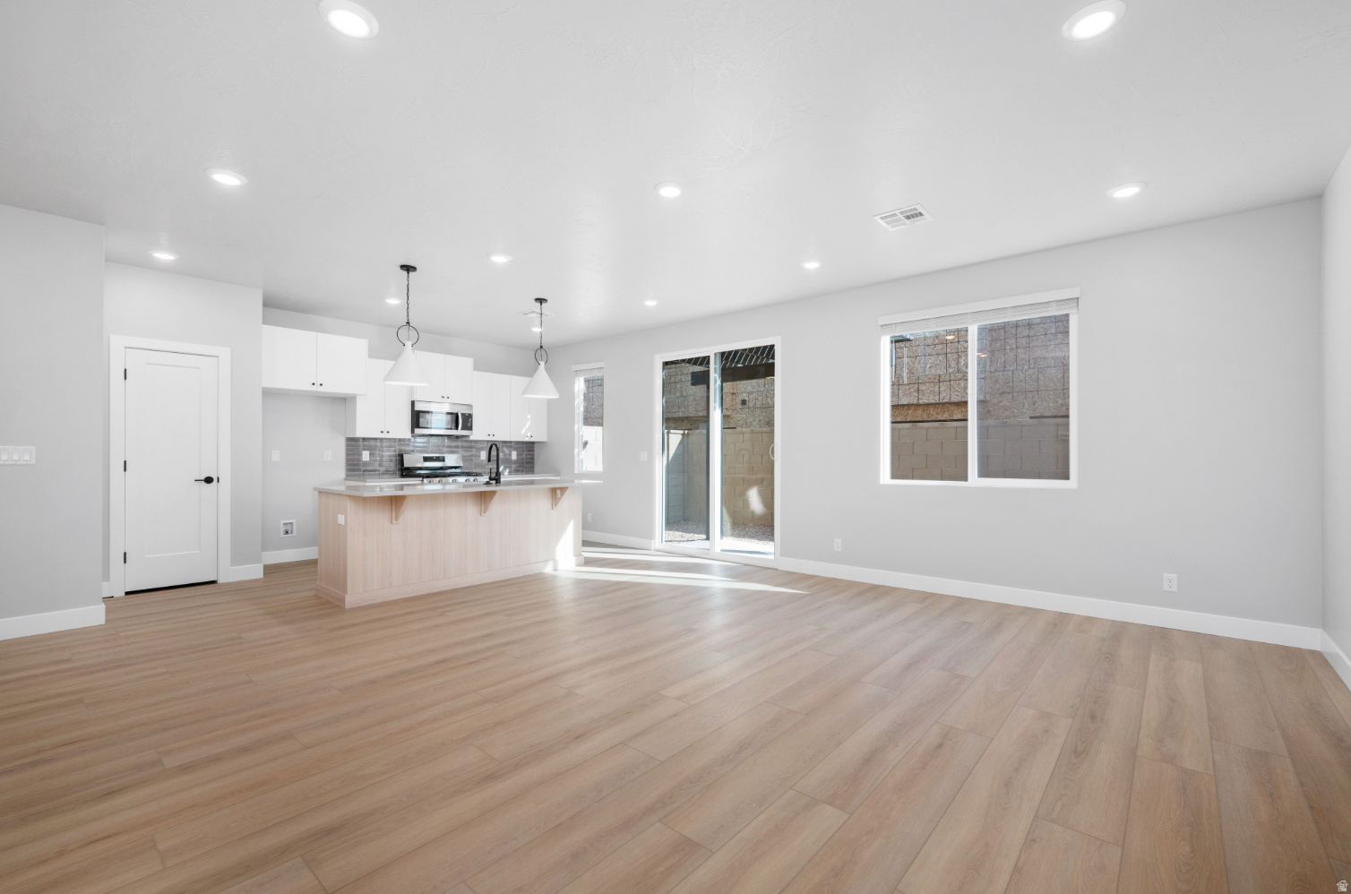 Welcome to the Sunburst, a beautifully crafted 2-story townhome featuring 3 bedrooms and 2.5 bathrooms within 1,843 square feet of refined living space. The standout feature of this home is the versatile loft, perfect for creating a second living area or enjoying family movie nights. Two of the bedrooms offer spacious walk-in closets, while the primary suite boasts a sleek Euro glass shower and dual vanity for an elevated bathroom experience. Designed to simplify everyday living, the Sunburst features a conveniently located second-floor laundry room, along with a 2-car garage and high-end finishes, offering an elevated living experience in the sought-after Coral Canyon community.