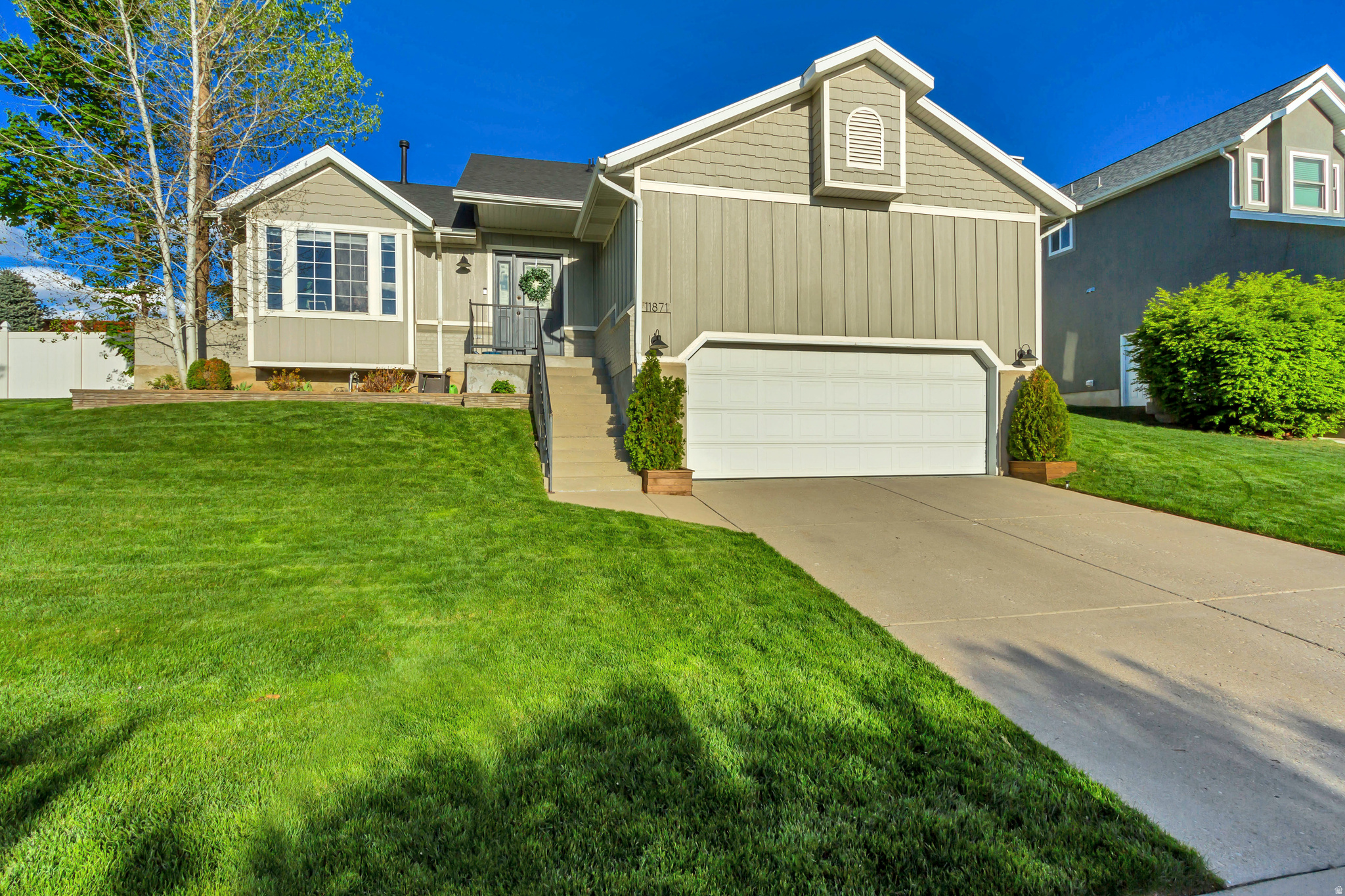 Welcome to this beautifully maintained two-story home nestled in a quiet cul-de-sac in the desirable Victor Pond neighborhood of Draper. Set on a spacious 0.21-acre lot with mature trees and a fully fenced yard, this property offers privacy, comfort, and stunning mountain views.  The thoughtfully designed floor plan features a rare main-level bedroom and bathroom-perfect for guests or flexible living. The heart of the home is the updated kitchen including  brand new SS fridge and oven, with a reverse osmosis water filtration system, also complete with granite countertops, and a seamless flow into the inviting family room, making it ideal for everyday living and entertaining.  Upstairs, the spacious primary suite boasts vaulted ceilings, a walk-in closet, and an ensuite bathroom with a separate tub and shower. Two additional bedrooms and a full bath complete the upper level.  Enjoy outdoor living on the large deck overlooking the shaded backyard-perfect for gatherings or quiet evenings. Recent updates such as new roof, newer carpet, fresh paint, and central A/C add to the home's move-in-ready appeal.  The unfinished basement provides excellent potential for future expansion, a home gym, or additional storage space.  Conveniently located near parks, shopping, and top-rated schools, this home offers the perfect blend of comfort, location, and opportunity.  Square footage figures are provided as a courtesy estimate only and were obtained from tax data records.  Buyer is advised to obtain an independent measurement.