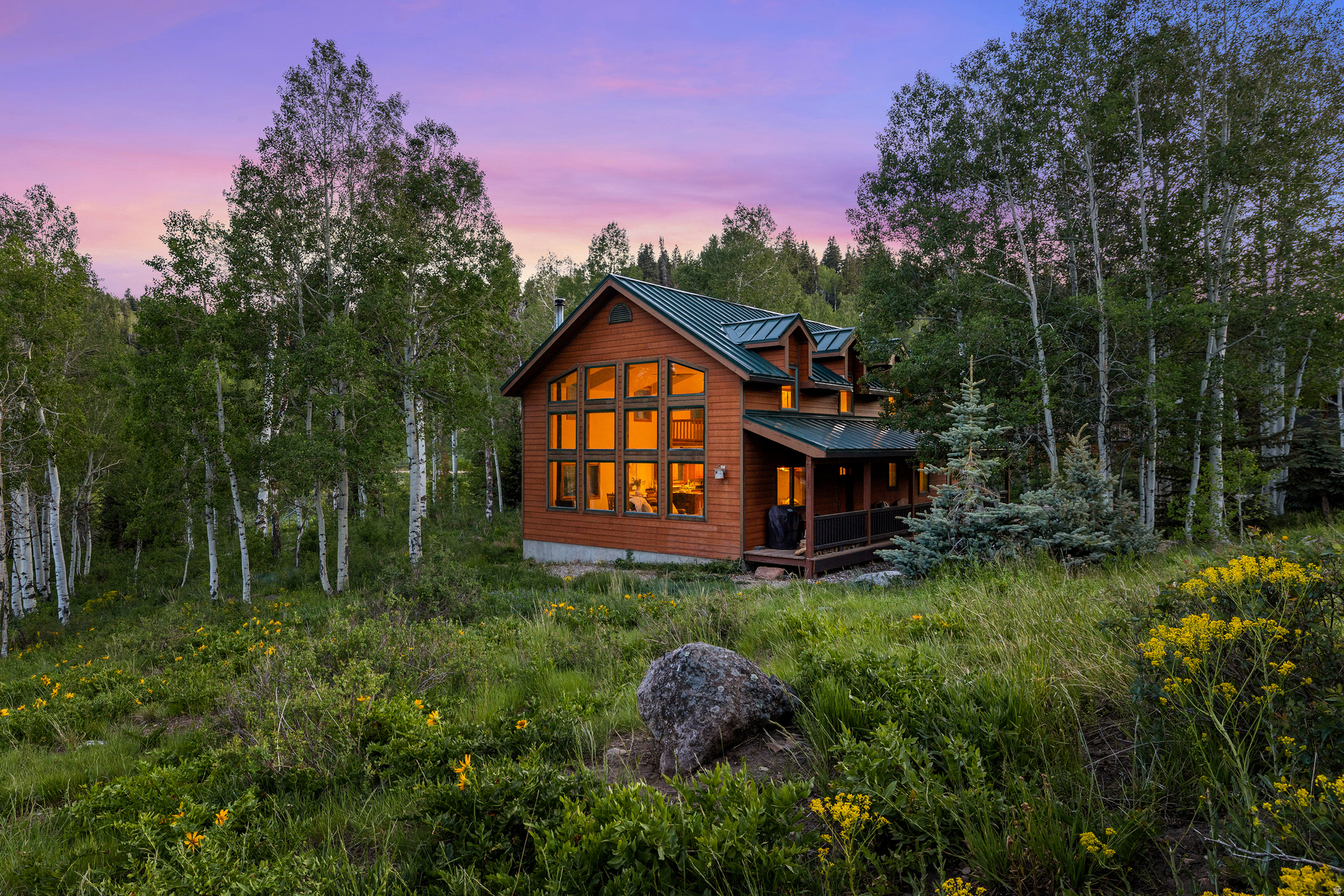 Welcome to 2085 Pine Meadow! Tucked into the trees of Tollgate Canyon, this private 4-bedroom, 3-bathroom mountain retreat offers the ideal combination of privacy, year-round access, and convenience. Surrounded by mature trees and mountain scenery, the property provides a peaceful setting just minutes from Park City and within easy reach of Salt Lake City, making skiing, dining, shopping, recreation, and commuting readily accessible.  The spacious floor plan features an open-concept living room and kitchen, highlighted by floor-to-ceiling windows that fill the home with natural light and frame the surrounding landscape. Generous bedrooms provide ample space for family and guests, while the expansive deck offers the perfect place to enjoy the fresh mountain air and scenic views. In addition, the property features a highly coveted asphalt driveway and an attached garage with additional storage.  Whether you're seeking a primary residence, weekend escape, or investment property, this home is well-positioned to enjoy everything Utah's four-season mountain lifestyle has to offer.
