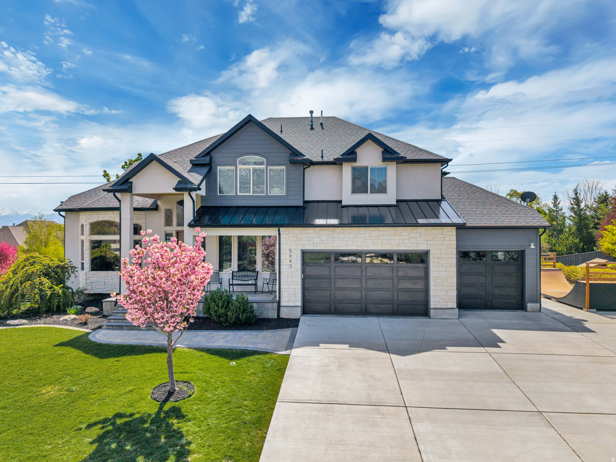 Recently renovated and thoughtfully updated, this home brings together elevated design and everyday livability in all the right ways. The kitchen has been completely redone with high-end cabinetry & finishes, opening to a butler's pantry with ample storage, prep sink, a pebble ice machine, and an additional dishwasher, making it incredibly functional whether you're hosting or just going about your day. The main living area is open and inviting with tall ceilings and great natural light, and the mudroom with built-in lockers gives you that extra layer of practicality. The home is also equipped with a Vivint Smart Home System, allowing you to easily control lighting, climate, and security. Large backyard with space to entertain complete with a built-in trampoline, and a private wellness setup featuring a sauna, spa, & cold plunge. Downstairs, the home boasts a dedicated gym, a private theater room, and a walkout basement that connects directly to the backyard, giving you even more flexibility for both everyday living and hosting. With incredible views and a layout that just makes sense, this is one that stands out for how well it lives as much as how it looks. Buyer/Buyer's Agent to verify all information.
