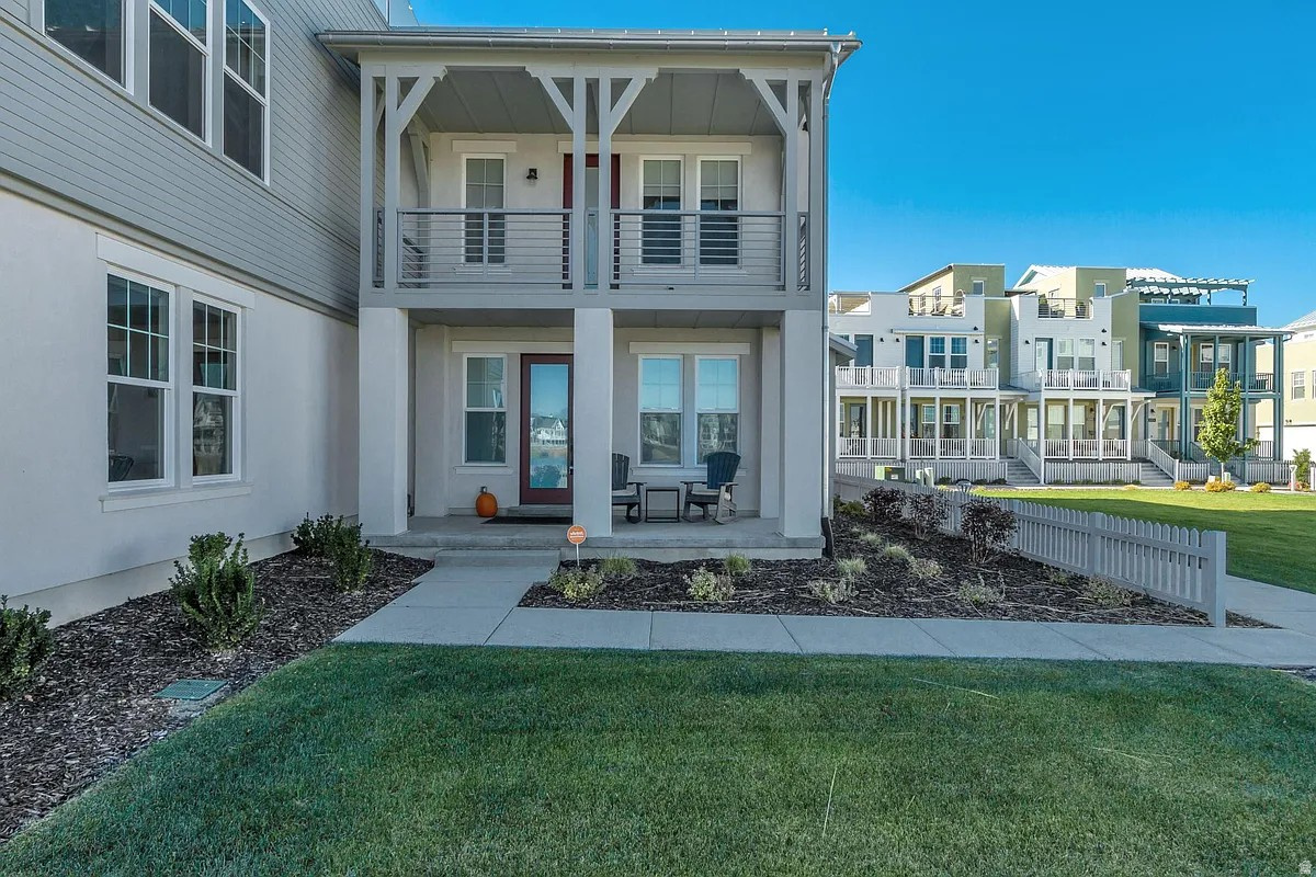 Come see the best and most desirable unit in the coveted Marina Village community at Daybreak. Lakefront, with unobstructed lake views. End unit with ample windows and natural daylight. Less than one minute walking distance to Daybreak kayak and boat rentals, the farmers market held every Saturday during the summer, and only steps to the lakefront pedestrian pathway. Multiple decks invite peaceful outdoor living while the rooftop deck begs for gatherings of family and friends, good food, and warm summer breezes. The home has $15,000 in upgraded window coverings together with a large hidden safe that cost $8,000. This unit is in pristine, like new condition. The unique location, larger unit size, pristine condition, and upgraded features of this home are well worth the look.