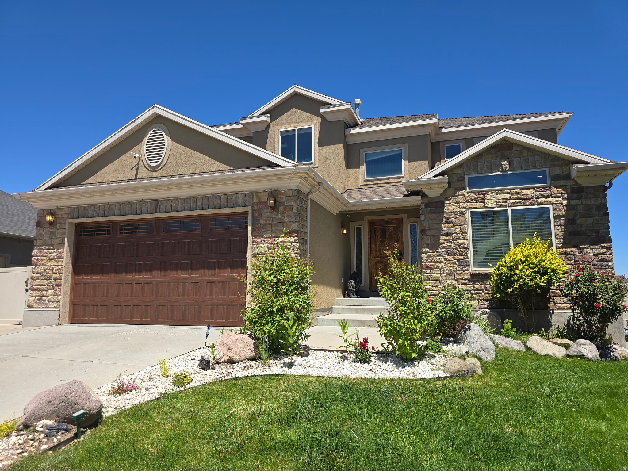 Beautifully updated 5-bedroom, 3.5-bath home in one of West Jordan's premier communities, conveniently located near Mountain View Corridor and Bangerter Highway. This spacious home offers a flexible floor plan featuring a dedicated home office, large 2-car garage, RV parking, and a fully finished mother-in-law apartment/ADU complete with a second kitchen.  Recent upgrades include stylish new LVP flooring, quartz countertops, fresh paint, new carpet, updated tile, baseboards, and modern fixtures throughout. The open-concept design features soaring ceilings, abundant natural light, and ample storage space.  Enjoy the convenience of neighborhood amenities, including parks, playgrounds, and a community pool, all just steps from your front door. This home combines comfort, functionality, and versatility in an unbeatable location!
