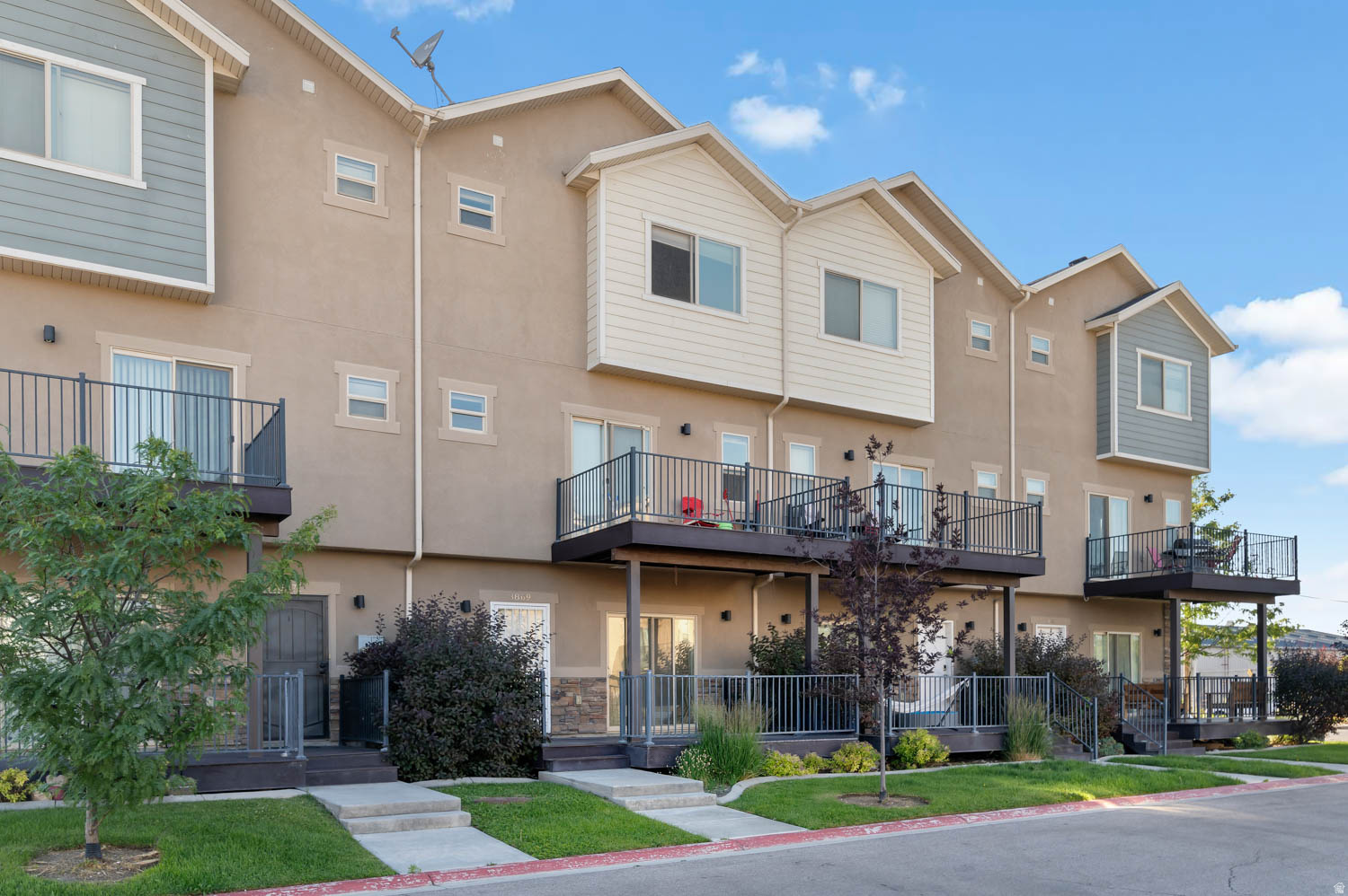 Welcome to this spacious and well-maintained townhome in the heart of West Valley City. With over 2,000 square feet of living space, this home offers 4 bedrooms, 2.5 bathrooms, and a functional multi-level floor plan designed for comfortable everyday living.  The open-concept main living area features vaulted ceilings, abundant natural light, and a spacious great room that flows seamlessly into the kitchen and dining area.Upstairs, you'll find generously sized bedrooms, including a primary suite with a walk-in closet and private bath featuring a separate tub and shower. A covered deck and private balcony provide additional outdoor living space and beautiful mountain views.  Conveniently located near shopping, dining, schools, parks, and commuter routes, this home offers the perfect combination of space, comfort, and accessibility. Don't miss your opportunity to make this move-in-ready townhome your own!