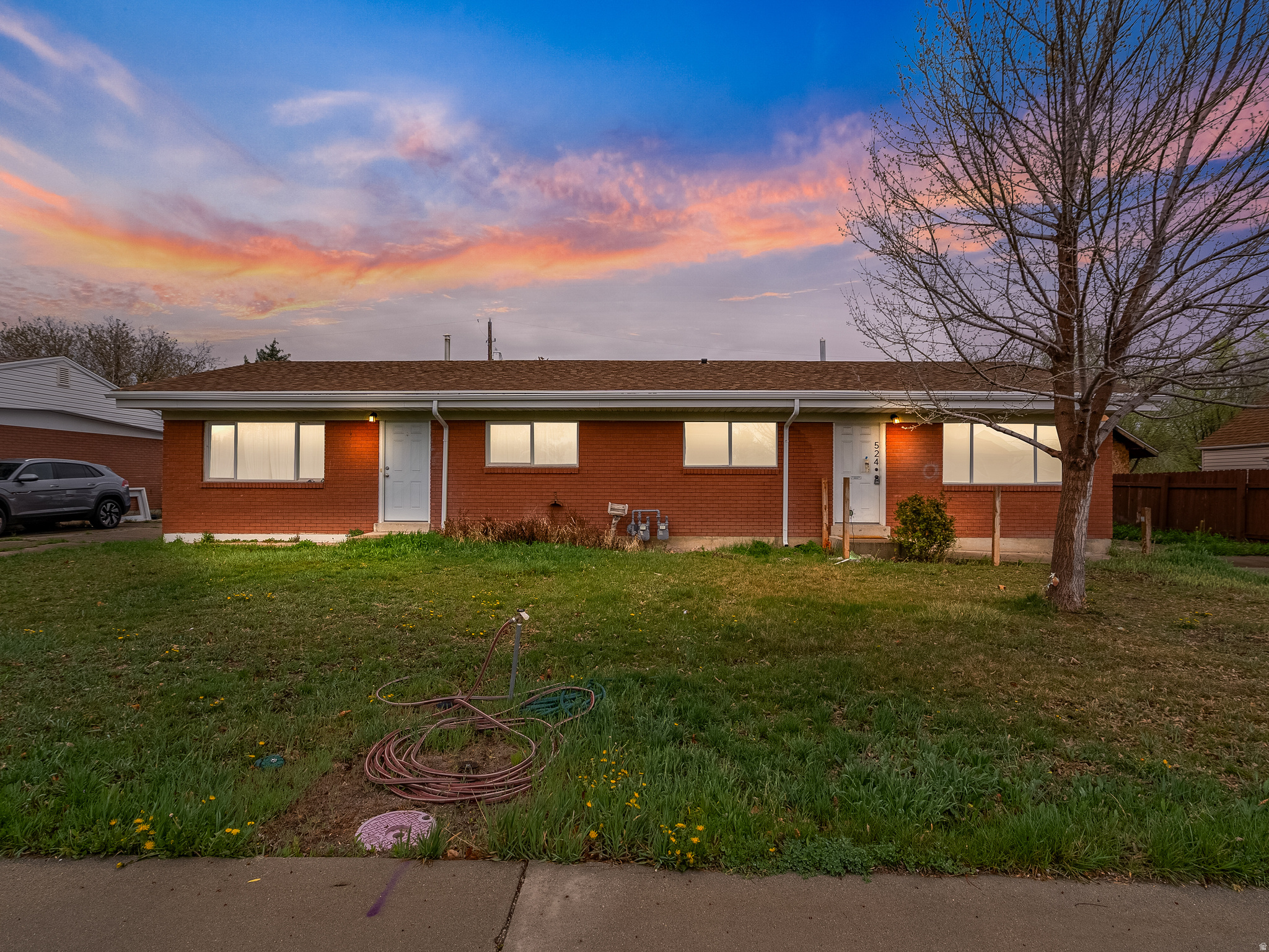 Live for less in one of Lehi's most desirable neighborhoods and let your tenant help pay the mortgage. This beautifully renovated duplex puts you in a like-new 2 bed/1 bath home while the adjacent unit generates $1,650/mo in rental income. The vacant unit is yours to move right into: fresh paint, new cabinetry, updated countertops, a tiled shower surround, and an in-unit washer/dryer make it feel anything but "investment property." Step outside to your own private backyard fully separated from the other unit so you still get that single-family feel. With Lehi's continued growth, strong rental demand, and a renovated, income-producing asset right next door, this is one of the smartest ways to enter homeownership in Utah County today.