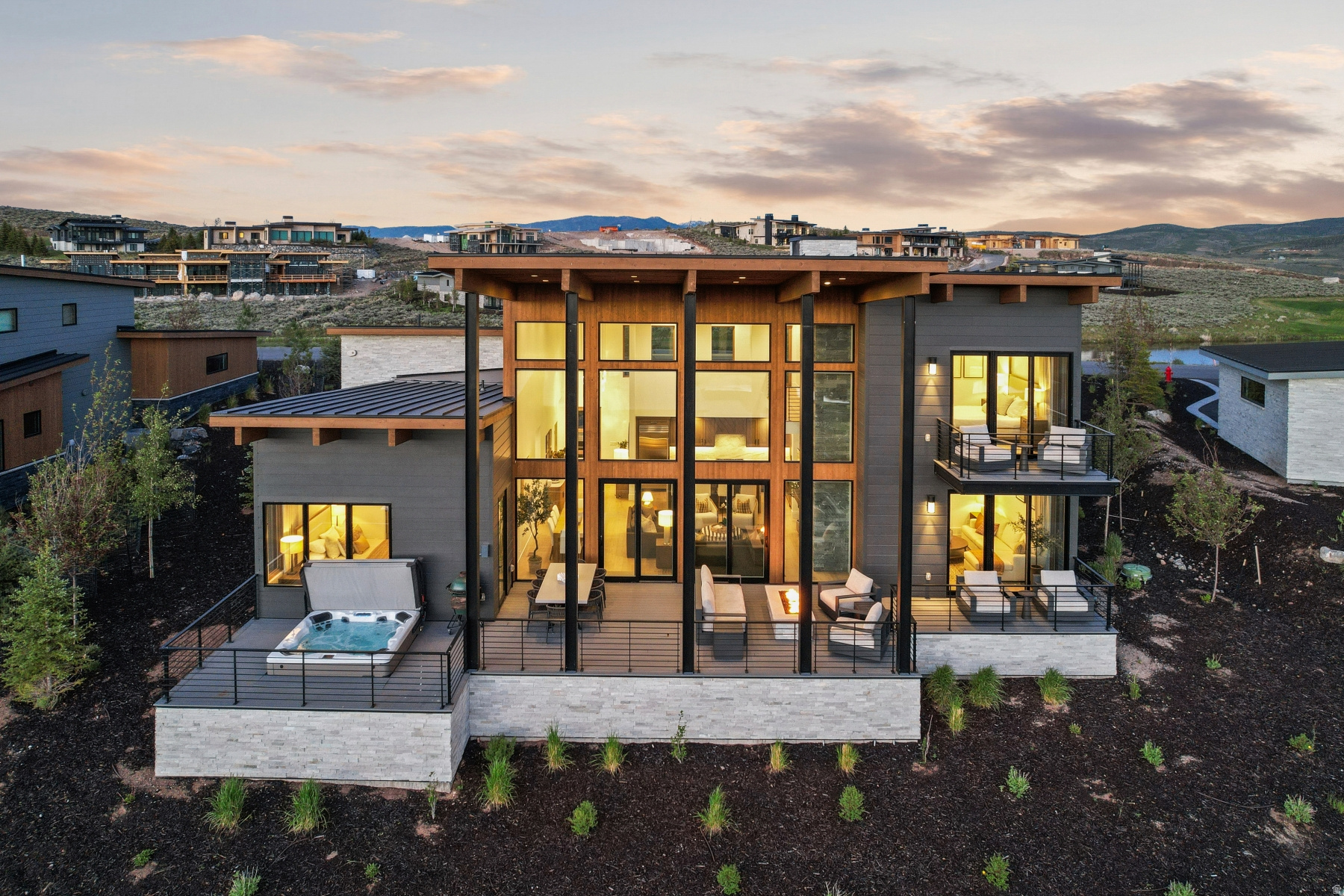 Perched above the 17th fairway of Promontory Club's acclaimed Painted Valley Golf Course and facing one of the most desirable views Western views in the community, this immaculate 4-bedroom Rothko Villa offers an exceptional blend of mountain sophistication, panoramic views, and effortless maintenance. A Full Golf Membership is available for immediate transfer, providing the rare opportunity to enjoy Promontory's premier golf and lifestyle amenities without waiting. Offered furnished and turnkey, the residence showcases soaring 18-foot ceilings and dramatic walls of glass that fill the home with natural light while perfectly framing sweeping views of the golf course, surrounding open space, and the majestic Wasatch Mountains beyond. The thoughtfully designed open-concept floor plan centers around a gourmet kitchen featuring stainless steel appliances, a stunning oversized quartzite island, and seamless flow into the great room and dining areas. Expansive outdoor living spaces elevate the experience, including a spacious main-level deck ideal for entertaining, dining al fresco, and stargazing from the sunken hot tub. Two additional upper-level decks provide multiple vantage points to enjoy spectacular sunrises, sunsets, and evening skies. Each of the four bedrooms offers comfort and privacy for family and guests alike, making the home equally suited for full-time living or a luxurious mountain retreat. Located within walking distance of The Peak restaurant, Promontory's state-of-the-art fitness center, and 7,000 square foot Spa at Promontory, owners enjoy convenient access to some of the community's most sought-after amenities. Whether hosting friends after a day on the course, enjoying a quiet evening by the fire, or embracing Promontory's unmatched four-season lifestyle, this exceptional Villa represents a rare opportunity to own one of the finest Villas within Park City's premier private club community.