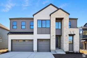 Enjoy breathtaking views of Mt. Timpanogos from the serene community of The Crossings at Lake Creek. Whether relaxing on the covered patio, gathering in the expansive great room, or unwinding in the elegant primary suite, this home offers a perfect blend of comfort and natural beauty. The gourmet kitchen is a true centerpiece, featuring an oversized island and a premium Caf gas cooktop-ideal for cooking and entertaining. A convenient main floor guest suite provides flexibility for visitors or multi-generational living, while a dedicated office offers the perfect work-from-home space. Upstairs, the luxurious primary suite is designed for relaxation, complete with dual closets and a spa-inspired bathroom featuring a soaking tub. Designer-selected finishes by an award-winning team add style and sophistication throughout. This thoughtfully designed home includes four spacious bedrooms, three beautifully finished bathrooms, and an unfinished basement ready for your personal touch. Square footage figures are provided as a courtesy estimate only and were obtained from the builder. Buyer is advised to obtain an independent measurement.