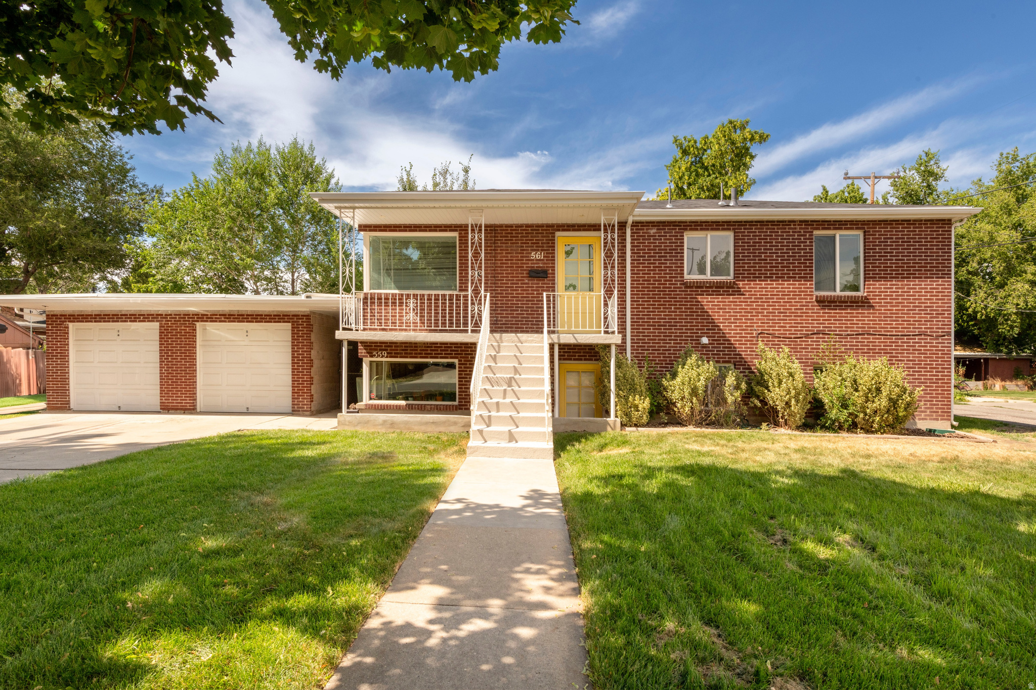Fabulous Liberty Wells brick duplex. Originally built as a duplex in 1957 with separate gas and electric meters. Well designed with 3 bedrooms,  1 bath upstairs unit and 2 bedroom, 1 bath downstairs unit. Separate laundry room with two sets of washer/dryers. Two car garage. Great lot with nice fenced back yard.  Upstairs unit has a sitting porch. Quiet residential street. Great for owner occupied or investment property. Four blocks from Liberty Park. Please do not disturb lower unit tenants.