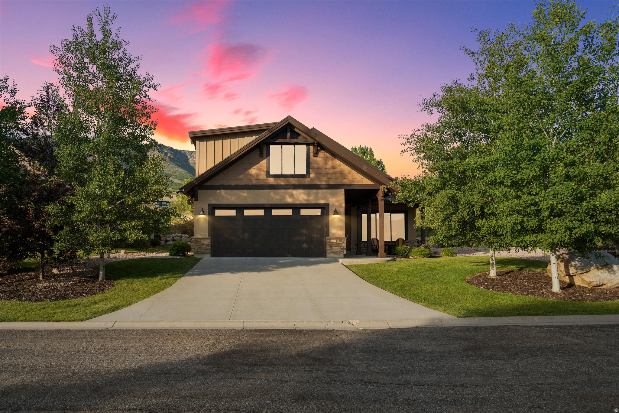 Welcome to this beautifully designed two-story home in the highly sought-after Trappers Ridge community of Eden, offering rare unobstructed views of Pineview Reservoir, Snowbasin Resort, and Ogden Valley. This four bedroom / four bath home, being sold furnished, is ideal as a primary residence, mountain retreat, or short-term rental. The mountain-modern design and open-concept living area features vaulted ceilings, exposed beams, a cozy fireplace, and expansive windows that fill the home with natural light while showcasing the mature landscaping and spectacular setting.  Designed for ease and convenience, this home has three main-level bedrooms, anchored by the spacious primary suite with walk-in closet and ensuite bath. Another ensuite bedroom up front with sweeping views and a third with an adjacent full bath. Upstairs, a fourth bedroom and additional family room with full bath provide flexible space for guests and entertaining.  Outside, the in-ground spa and private patio framed by mature landscaping, creates the perfect setting for relaxing and enjoying every season. Residents also benefit from the beautifully maintained common areas and resort-style HOA amenities. Square footage figures are provided as a courtesy estimate only. Buyer is advised to obtain independent measurements.