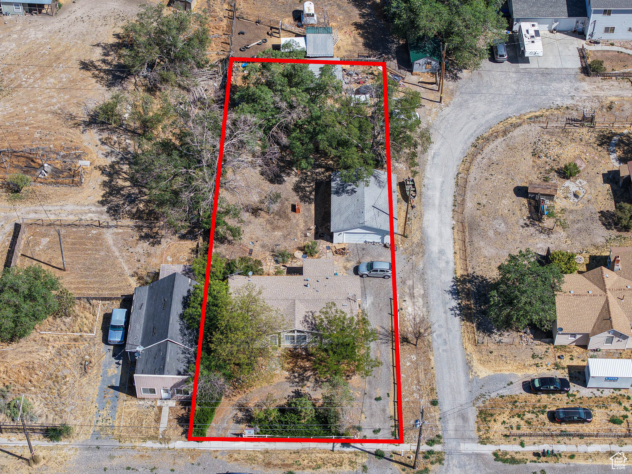 Development opportunity, Land in Grantsville with frontage on Main Street in great location.  Total of 32.64 acres which includes three (3) properties. The other properties are MLS #2158350 at 699 E MAIN ST which includes Tax ID 12-102-0-0003 which is 25.62 Acres and Tax ID # 01-057-0-0019 which is 6.68 acres . The Three (3) properties must be sold together. There are homes that are currently rented on 2 of the properties, but the value is in the land. Seller has both Culinary (acre feet) and Irrigation shares that are not included in the price, must be negotiated separately. There is also additional land available, call agent for details.