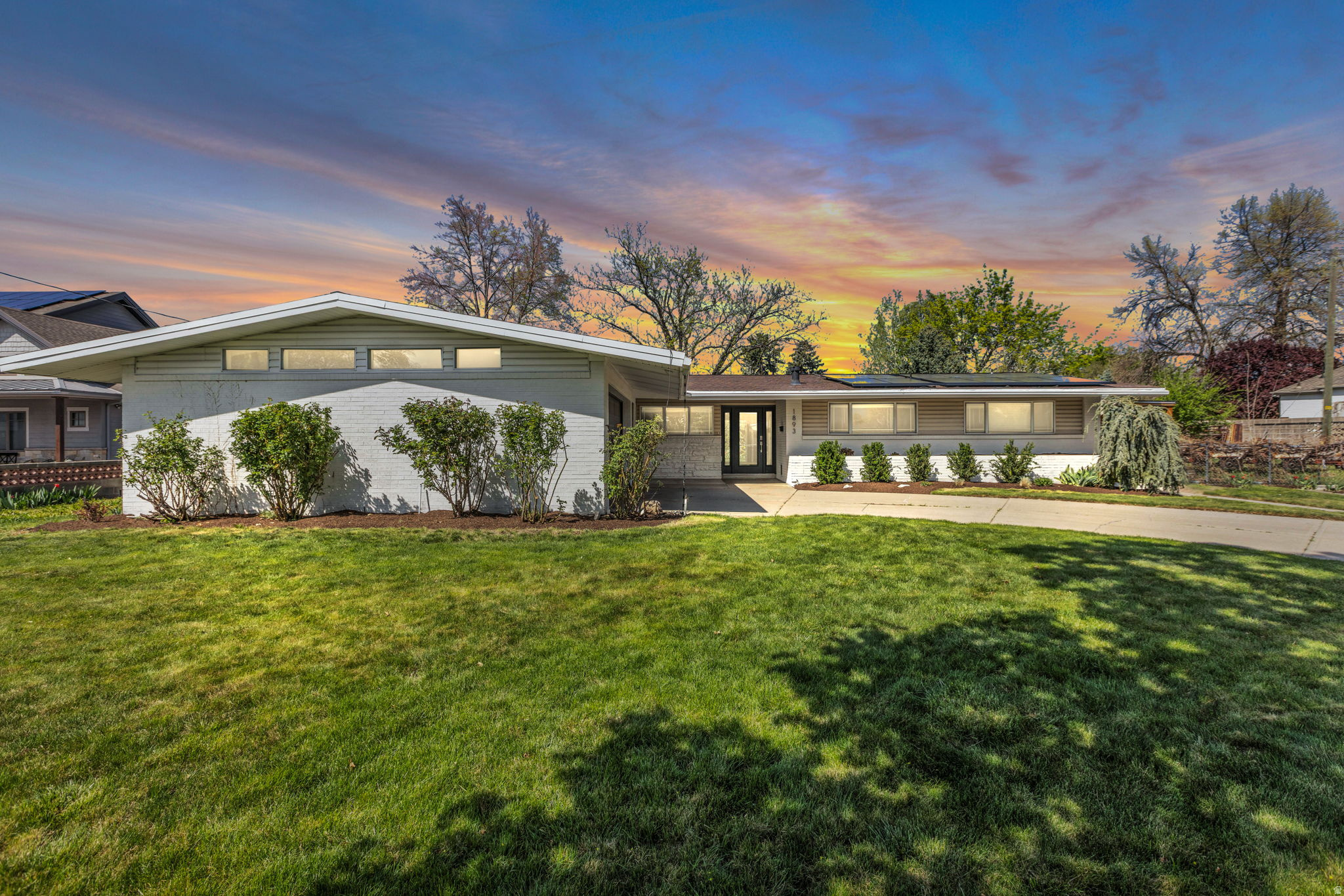 Must See Holladay Home! Recently remodeled and located in one of Holladay's most sought-after neighborhoods, this stunning 4-bedroom, 3-bathroom single-family home combines modern luxury with everyday comfort. The open light-filled floor plan flows seamlessly from the main living area to a chef's dream kitchen with striking quartz countertops, soft-close cabinets, top-of-the-line Thor appliances, a 36-inch gas stove, and a spacious pantry. The inviting upstairs living room is anchored by an elegant custom fireplace with a dramatic stacked-stone surround and is mirrored by the open downstairs multi-purpose space great for family activities, movie watching or an epic playroom. The spacious primary suite includes a large walk-in closet and a spa-inspired bathroom with a soaking tub, oversized shower, and dual sinks. A standout feature is the private basement apartment with its own entrance, offering excellent flexibility for multi-generational living, guests, or rental income. Outside, the almost half acre lot is beautifully landscaped and includes mature trees providing shade and fresh fruit, perennial flowers, garden space, multiple sheds, a workshop, putting green and RV/boat parking. The outdoor areas provide privacy and room to relax, recreate and entertain. The property also offers stunning views of Mt. Olympus and is conveniently located near top-rated Holladay schools, parks, shopping, dining, Big and Little Cottonwood Canyons, and downtown Salt Lake City.