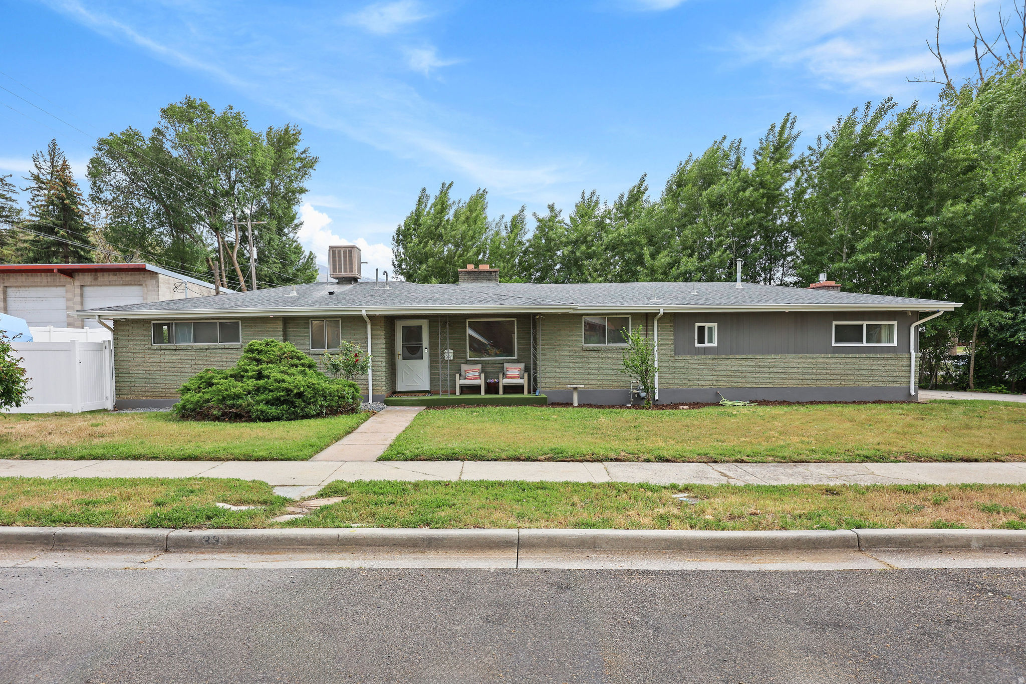 This commercially zoned property could be used for an office, retail, or maybe an Airbnb as an alternative or in addition to using it as a home.  It is currently a single family home, but offers 3 bedrooms and a bath with kitchen and living on the east side of the house.  The west side, that was likely a garage at one time, has another flex room or bedroom, a bath and a room with gas insert fireplace.  You could use a portion for your residence and the other for your business.  Use the full structure for a business or retail space.  You decide what meets your needs.  Square footage figures are provided as a courtesy estimate only.  Buyer is advised to obtain an independent measurement and check with city for all available use options.