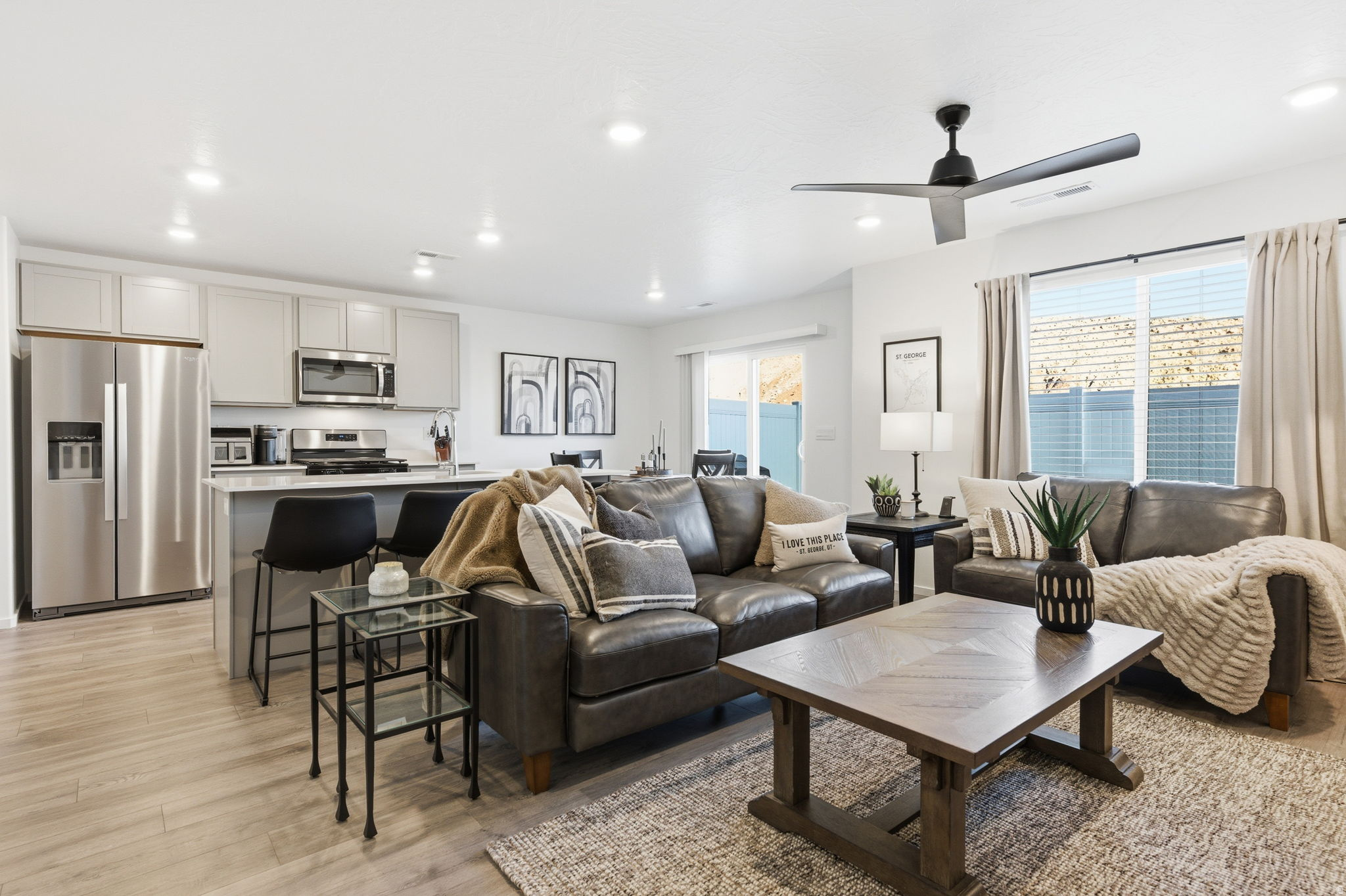 Ask about preferred-lender rate buy-down to help lower your monthly payment! Why wait for new construction when this 2023 Millbrook townhome is already finished, upgraded, and move-in ready! Builder upgrades already included: smart home package, full landscaping with auto sprinklers, window coverings throughout, and all appliances included (refrigerator, washer, dryer, water softener). Step out to a private fenced patio with mountain views -- no design center decisions, no construction delays, no months of waiting. Furniture is negotiable for a truly turn-key move. Walk to community pools, hot tub, pickleball courts, and clubhouse. HOA covers exterior insurance, landscaping & maintenance -- just lock and leave. Schedule your showing today!