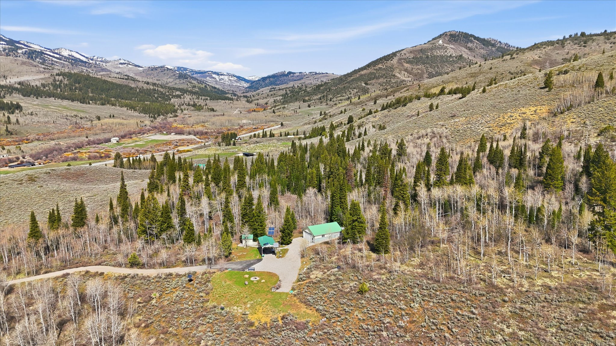 Want to escape the noise and own the mountain but still be close to Logan and 20 min from growing Bear Lake? Welcome to a fully self-sustaining, off-grid retreat tucked deep in Beaver Creek located in Logan Canyon. Offering 41.63 acres of pristine Utah wilderness where privacy, power, and possibility collide. Nestled in Aspens and Pine Trees and next to Open Forest Property. Includes private water well. This Garage-a-minimum style residence blends rugged functionality with intentional comfort featuring 1,263 Sq ft of thoughtfully designed space, with plenty of room to grow. Outdoor shower for true canyon living. Built for those who don't just want land- but a lifestyle. Complete solar power system with generator backup. Private gated access + secured community entry. Snow cat INCLUDED! Workshop + infrastructure ready for year round use. Private outdoor shooting range. Custom fire pit under wide open skies. Surrounded by thriving wildlife habitat- elk, deer, and more. Endless space to expand, explore or simply disappear. Whether you're looking for a hunting basecamp, off-grid homestead or legacy mountain escape, this property delivers unmatched seclusion with the tools to live fully off the land- without sacrificing comfort. Opportunities like this don't come around often.