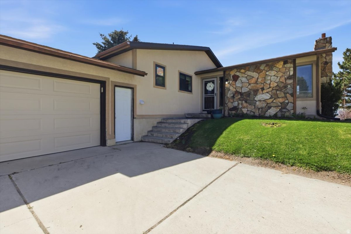 This spacious and inviting 6-bedroom, 3-bath home is one you won't want to miss! This well-maintained property has a lot to offer including an attached 2 car garage, 0.61 acres, and lots of functional space. The main floor hosts the primary bedroom, 2 additional bedrooms, and 2 full bathrooms while the basement hosts 3 more bedrooms and an additional full bathroom. The mature trees and fully landscaped yard create a private and peaceful setting. Conveniently located close to schools with quick access to shopping, dining, and the highway for an easy commute. This home has the space, location, and charm you've been looking for! Square footage figures are provided as a courtesy estimate only and were obtained from county records.  Buyer is advised to obtain an independent measurement.