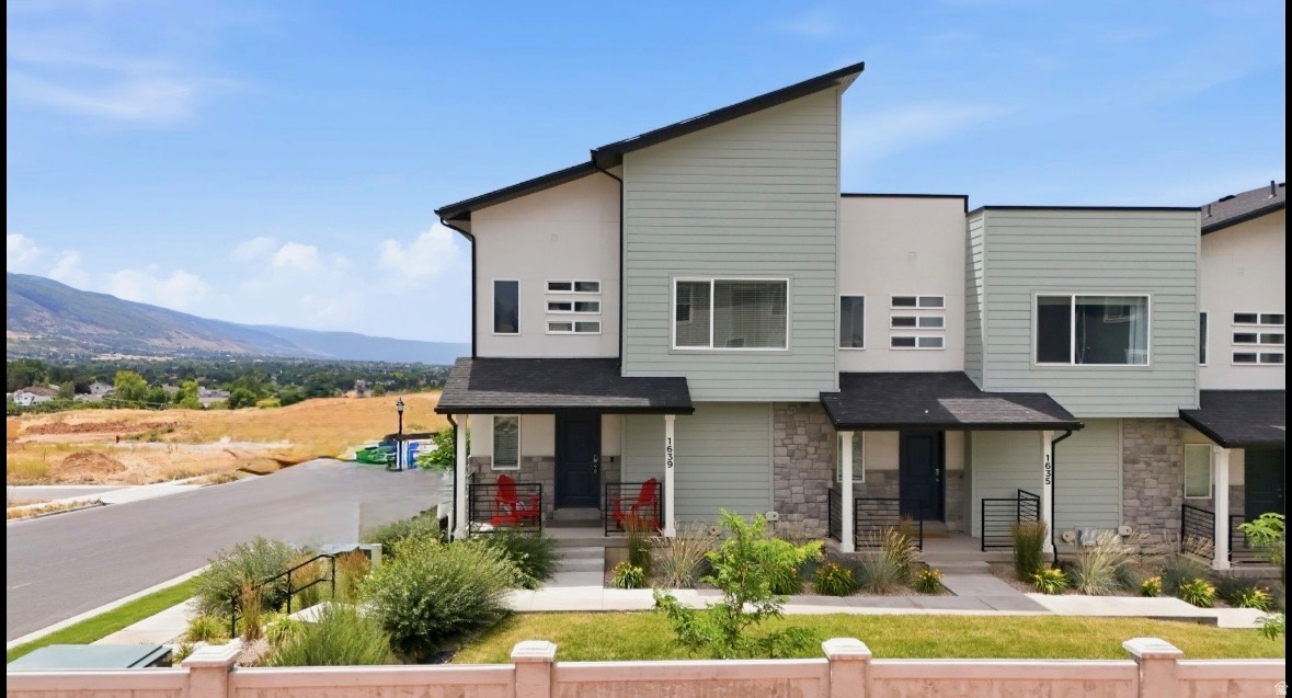 Say hello and welcome home  to this  beautifully maintained end-unit townhome offering the perfect blend of modern design, exceptional technology, and breathtaking views. Built in 2022 and lightly lived in as an investment property, this home presents in like-new condition. Featuring 1,892 square feet, the thoughtful design includes 3 spacious bedrooms, 2.5 bathrooms, and an attached 2-car garage. As one of the premier end units in the community, this home enjoys added privacy, bright natural light, and an exclusive advantage-it's the only townhome location with access to Sumo Fiber service, in addition to Xfinity. The property is currently equipped with Xfinity 1 GB internet plus two separate 10 GB fiber lines, offering exceptional connectivity for remote work, gaming, streaming, or a true smart home experience. Services are optional and can be customized to fit your needs. Another unique feature of this hillside end unit is the additional storage space created off the garage-an upgrade not found in many of the interior units. Enjoy beautiful views, contemporary finishes, and low-maintenance living in a home that feels virtually brand new. Conveniently located near shopping, dining, parks, schools, and commuter access, this is a rare opportunity to own one of the community's most desirable townhomes.