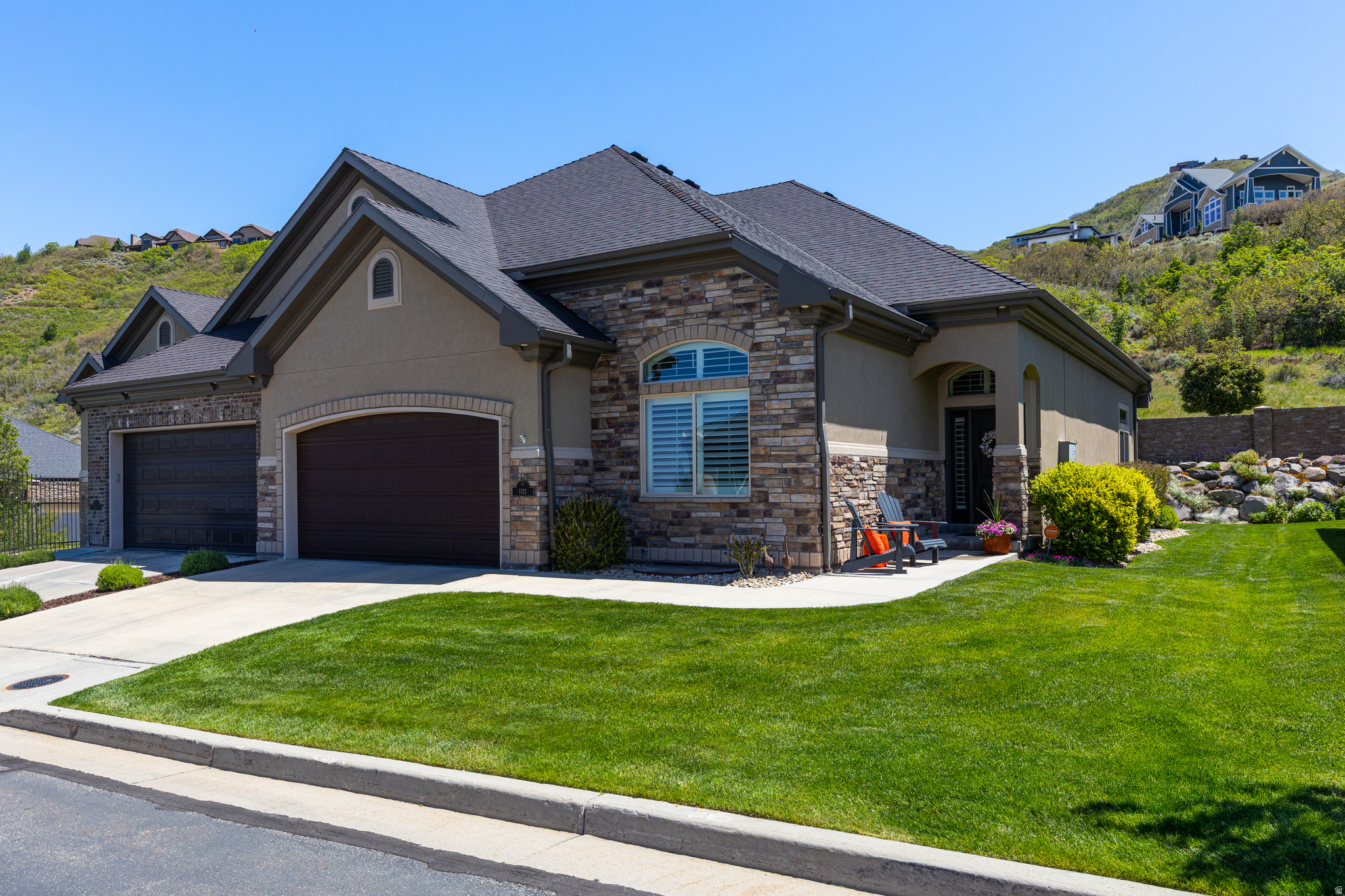 Rare find in one of Draper's premiere gated communities! Steps away from hiking and biking trails with spectacular views of both the valley and the mountains, this twin home is a true jewel. This spacious main floor living  home features an open layout with classic elegant features including a beautiful library that is truly one of a kind. A bright fully finished basement compliments the upstairs living area with a large family room, wet bar, 2 bedrooms, office, and game room with storage galore. New high efficiency air conditioner/heating unit less than 1 year old and EV plug-in. HOA includes yard and street maintenance as well as a beautiful swimming pool. Quick I-15 access and minutes to multiple ski resorts.