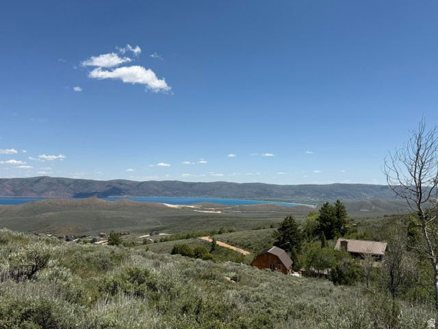 Tucked away on a private road in the desirable Sweetwater community, this beautiful mountain lot offers stunning views of Bear Lake and the surrounding mountains. Located high on the hillside, the property of surrounded by mature trees and natural vegetation, creating a peaceful, wooded setting with exceptional privacy. Enjoy cool mountain air, abundant wildlife, and breathtaking sunrises and sunsets from your future cabin or dream home. Don't miss this opportunity to own a piece of Bear Lake paradise!
