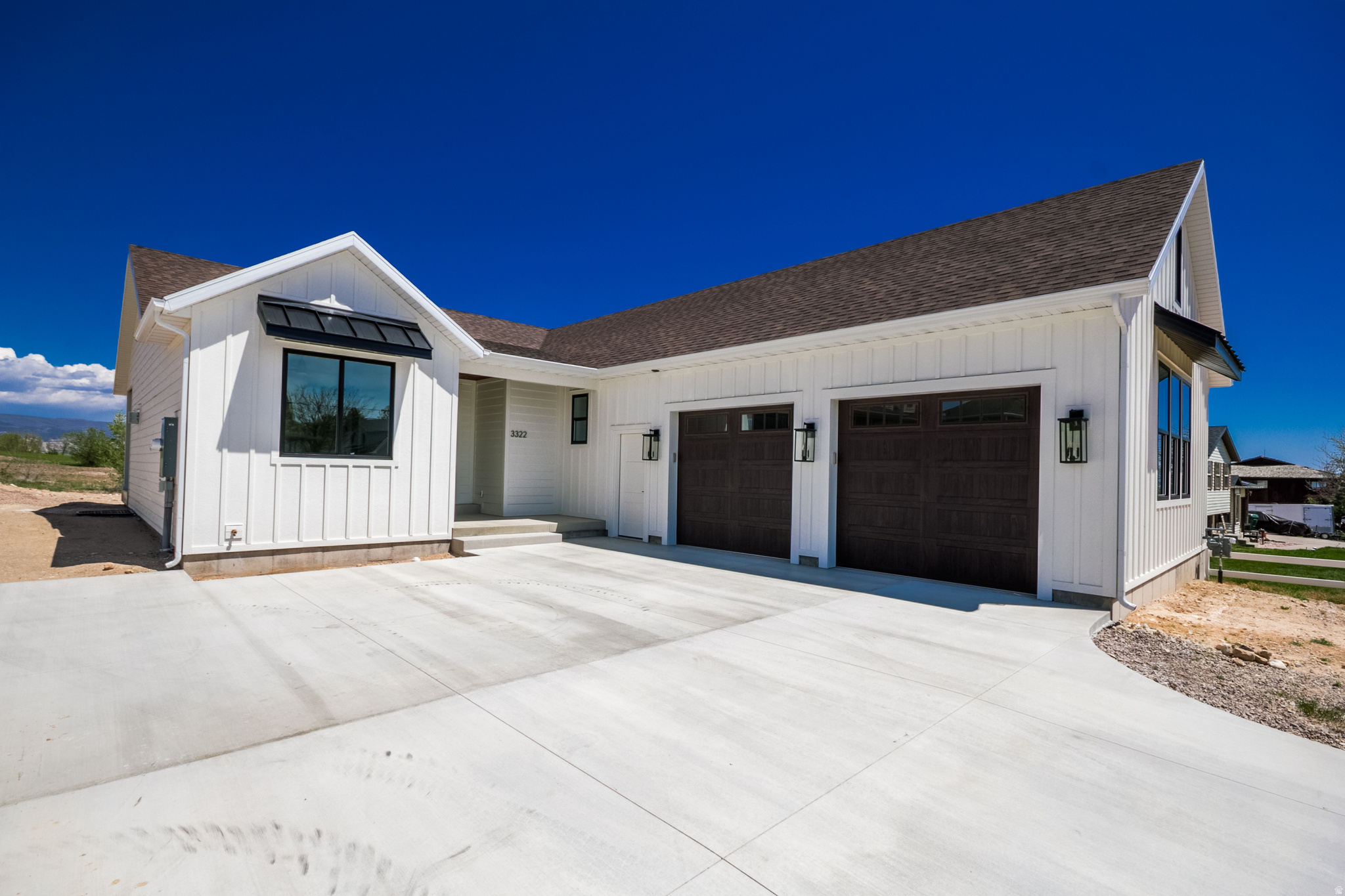 Experience elevated living in Vernal's premier Cottonwood Heights subdivision. Thoughtfully positioned to capture breathtaking views of Dry Fork Canyon across the entire back of the home, this custom new construction blends timeless design with modern luxury; offering country views with neighborhood conveniences. Inside, soaring vaulted ceilings, oversized doors, and an open-concept layout create a bright and expansive atmosphere designed for both everyday living and entertaining. The spacious kitchen flows seamlessly into the great room and covered back patio, creating an inviting gathering space enhanced by premium finishes throughout. The main-floor master suite offers a private retreat, while an additional bedroom or office and main-floor laundry provide flexibility and convenience. The basement features a large family room, additional bedrooms, full bathroom, generous cold storages, and unfinished space ready to customize to your lifestyle. An oversized garage offers ample room for vehicles, recreation gear, and storage. From the carefully designed floor plan to the panoramic canyon views, every detail of this home was crafted to deliver comfort, functionality, and refined living.