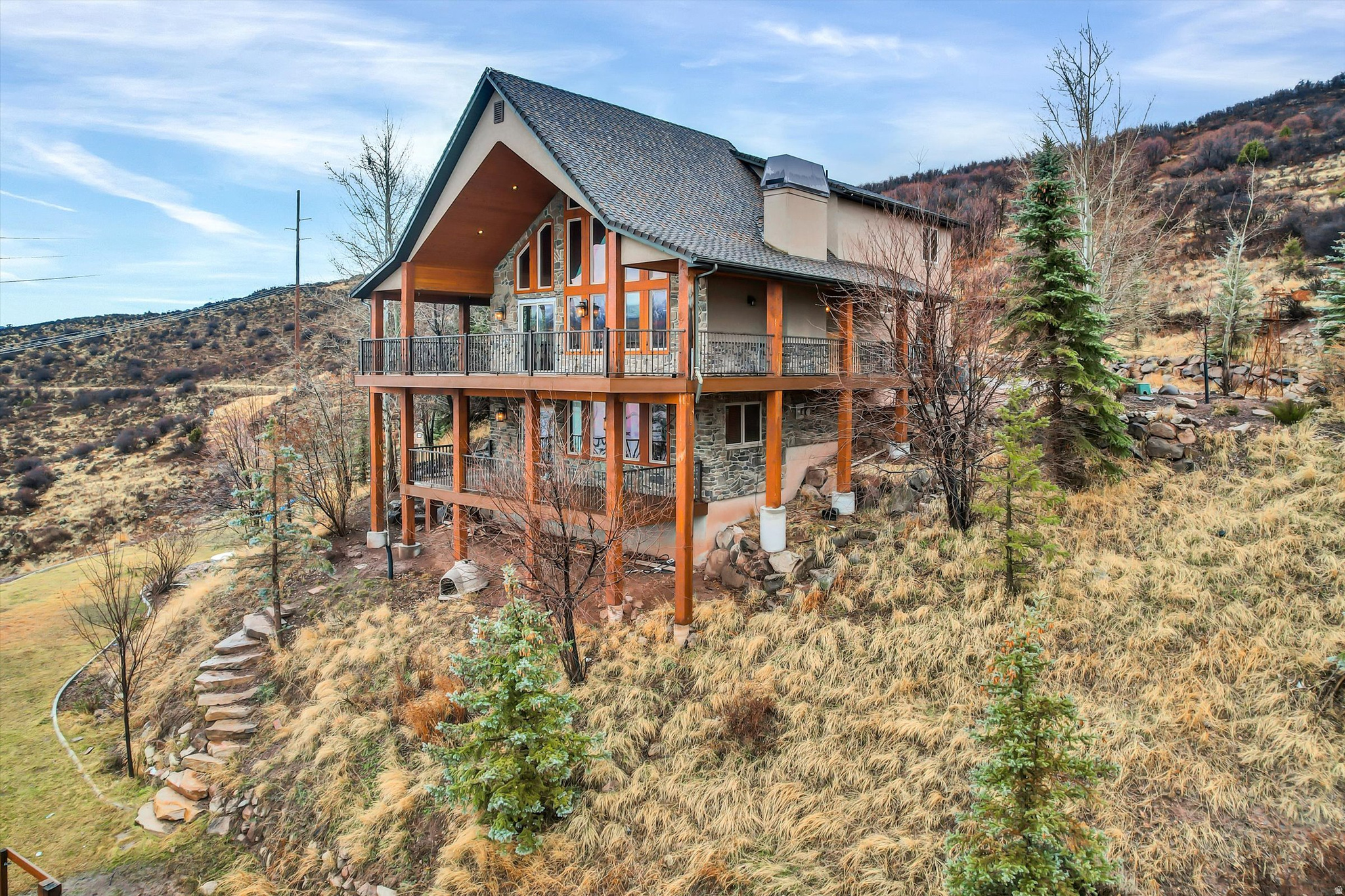 Price Reduced! Experience unmatched lake living from this extraordinary 20-acre retreat in Rockport Ranches, offering rare walkable access to Rockport Reservoir, panoramic lake and mountain range views, with two beautifully finished homes. Both homes are approved for nightly rentals!  The guest house with its own driveway and parking /garage, is just a 3-minute walk to the shoreline and the main cabin only 5 minutes, making this one of the closest lake-access properties available.  4423 square feet includes a remodeled 3,423 sq ft main cabin with 3 bedrooms and 3 bathrooms, , a 1,000 sq ft guest house  includes 2 bed 2 bath with a 1,000 sq ft storage/garage level, a heated massive, detached garage with EV charging, and exceptional infrastructure-private well, water rights, dual 200-amp services, septic, propane, and a 1,200-gallon underground irrigation. NO HOA.. Propane gas. Buyer to verify all information. See attached document for upgrades and improvements.