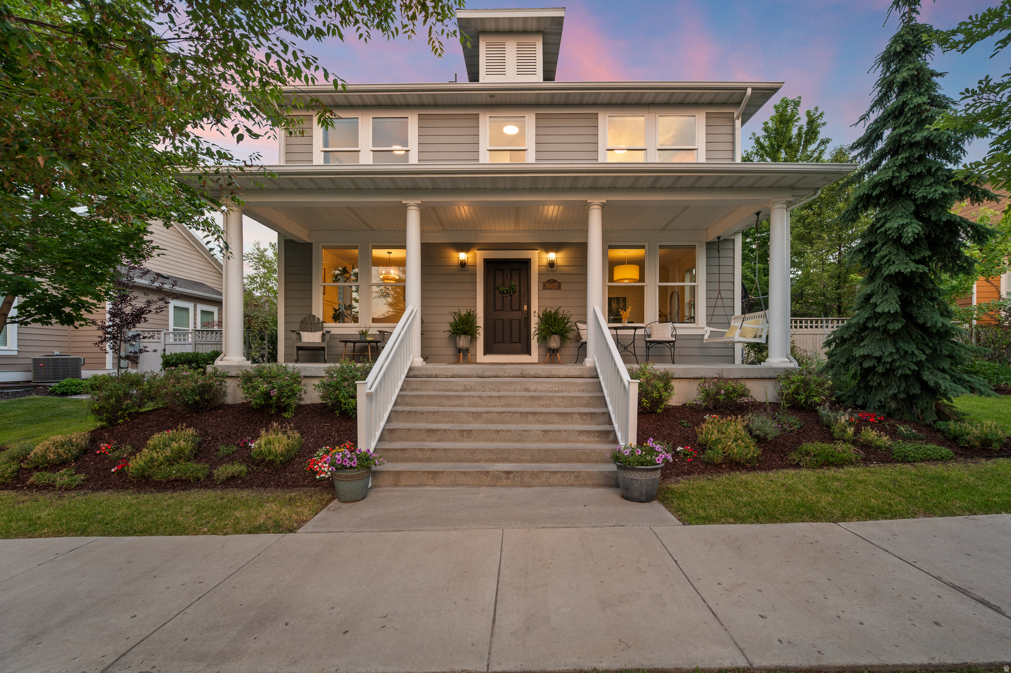 Welcome to one of Daybreak's most inviting homes-where thoughtful design, modern finishes, and exceptional outdoor living come together effortlessly. From the expansive covered front porch to the beautifully landscaped backyard, every space has been crafted to bring people together and make everyday living feel a little more special. Inside, natural light pours through oversized windows, highlighting warm wood flooring, custom millwork, designer lighting, and timeless finishes. The open, airy floor plan creates an effortless flow for entertaining while offering comfortable spaces for everyday life. The beautifully finished lower level features custom built-ins, a spacious family room, and a stylish wet bar-perfect for movie nights, game days, or hosting overnight guests. Flexible bedrooms, abundant storage, and thoughtfully designed spaces ensure there's room for everyone. The backyard is truly something special. A spectacular pergola-covered patio, inviting fire pit lounge, mature trees, and lush landscaping create a private backyard oasis that's equally suited for lively summer barbecues or peaceful evenings beneath the caf lights. Completing the property is an attached two-car garage and owned solar panels. Located in the heart of Daybreak, you'll enjoy one of Utah's most sought-after communities, where lakes, miles of walking and biking trails, neighborhood parks, local shops, restaurants, and year-round community events create a lifestyle every bit as exceptional as the home itself. This is more than a house-it's a place where neighbors become friends, every season brings new memories, and coming home is the best part of your day.