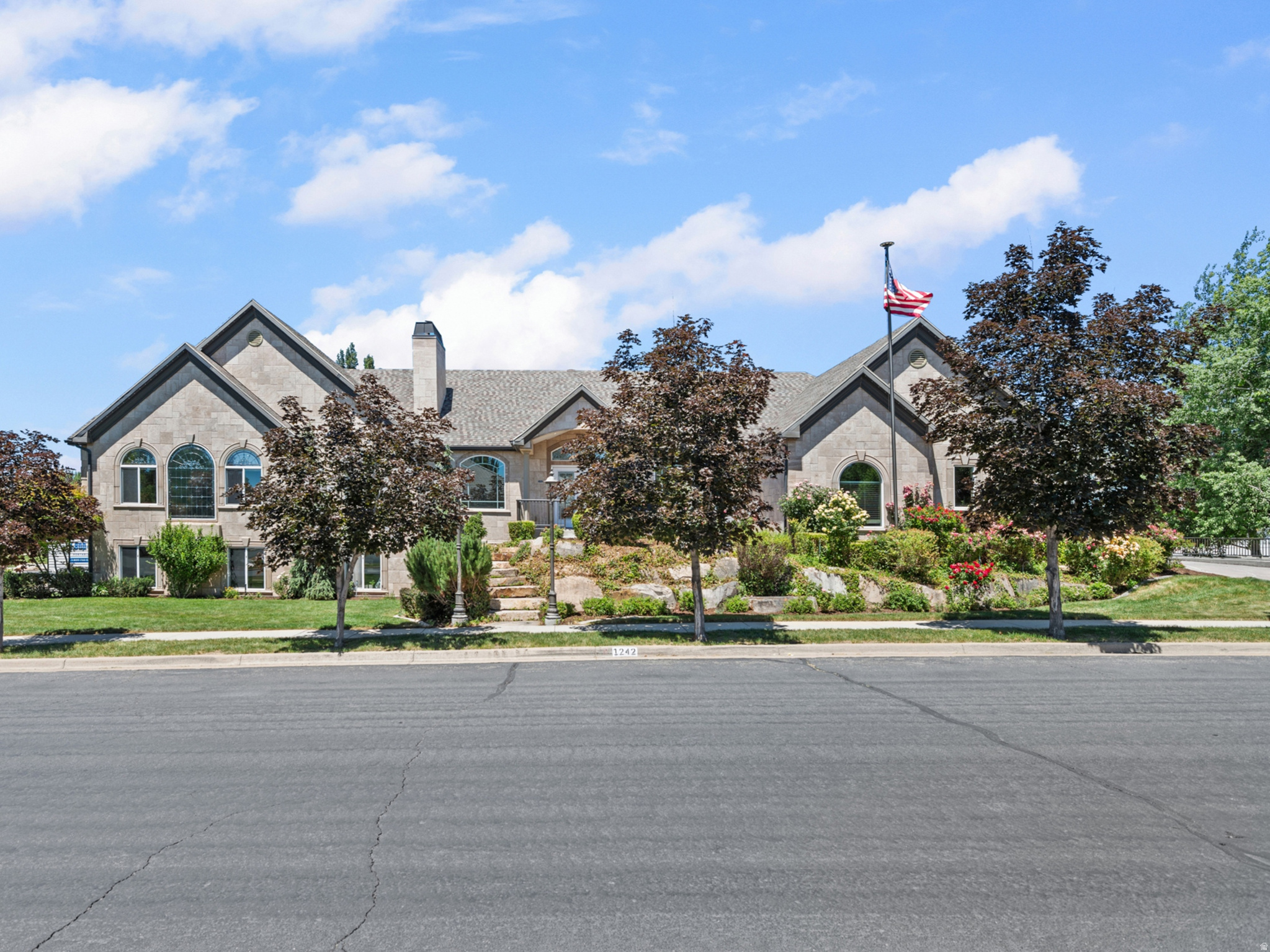 **GRAND OPEN HOUSE SATURDAY, 20 JUNE, 11 AM - 1 PM** European-inspired luxury meets timeless craftsmanship in this extraordinary 6,300 sq ft estate. Custom build, never before on the market. Wrapped in a stunning travertine exterior that naturally stays cool and enhances energy efficiency, this home offers sophisticated living with enduring character. Multiple bedrooms feature ensuite baths and walk-in closets. Imported artisan fixtures, custom stained-glass windows, and rich wood cabinetry elevate every space. The oversized island anchors a light-filled gourmet kitchen designed to be the heart of the home and a gathering place. Complete with a tiered theater room and fully equipped mother-in-law apartment. ADU boasts private entry, oversized garage, kitchen, laundry, and storage. Situated on a beautifully maintained corner lot with the perfect balance of lush flowering landscape, grass space, and hardscape - all framed by awe-inspiring mountain views. Jellyfish permanent lighting to celebrate every holiday in style! Google Fiber internet. You'll love Southern Davis County, known for its hyper-convenient location with a true non-city feel: 15 minutes to SLC International; 15 minutes to SLC City Center. All information deemed reliable, but not guaranteed; Buyer is advised to verify all.